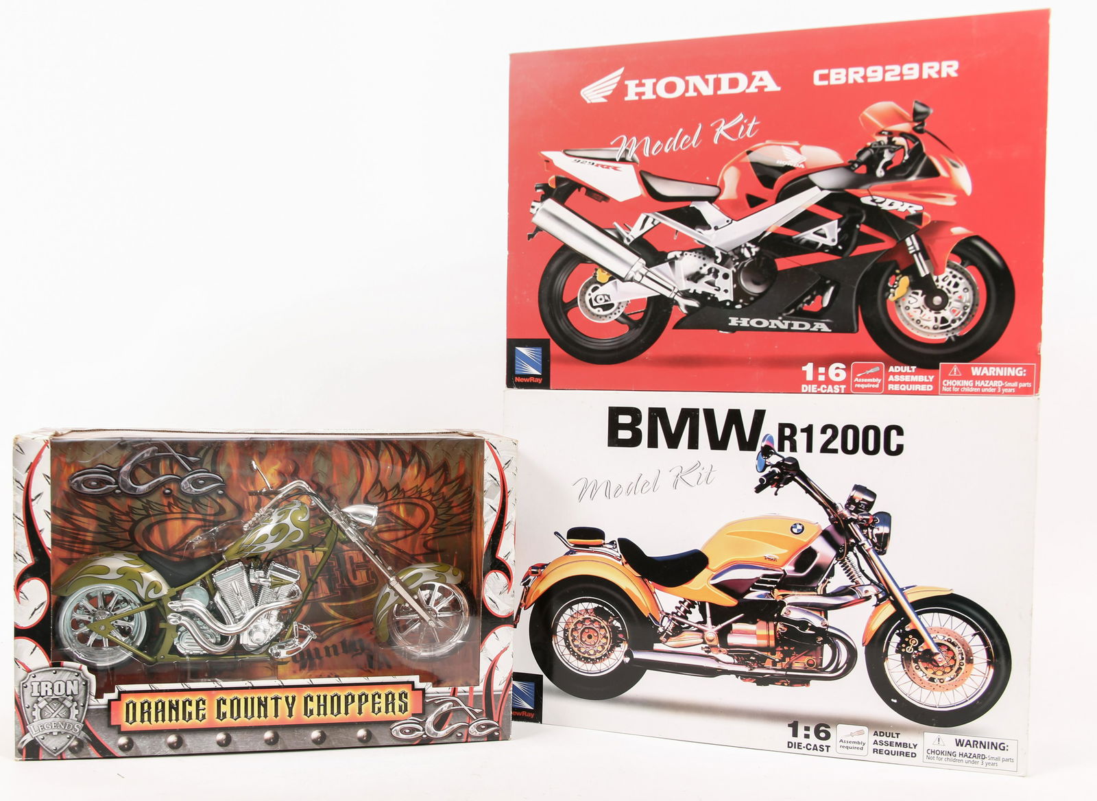 MOTORCYCLE MODELS - LOT OF 3: MOTORCYCLE MODELS - LOT OF 3 Motorcycle Models; excellent condition - new old stock; 1:6 scale (2 different manufacturers): NewRay: Honda CBR929RR BMW R1200C ToyZone: Iron Lege