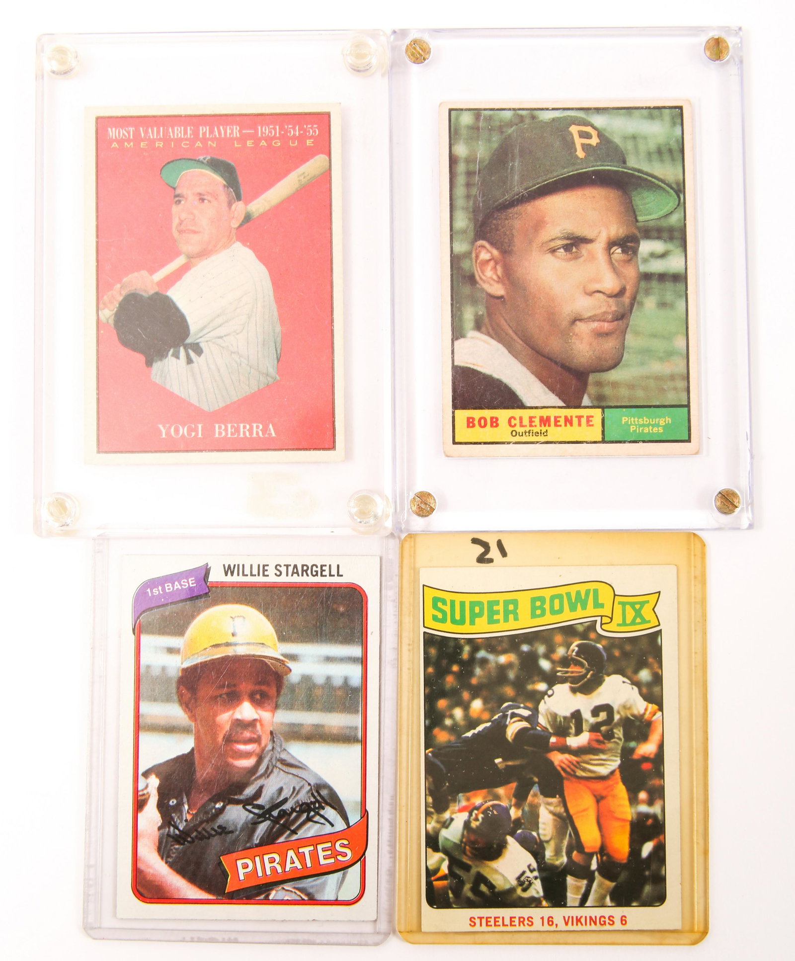 SPORTS CARDS YOGI BERRA, BOB CLEMENTE, WILLIE STARGELL: SPORTS CARD LOT - YOGI BERRA, BOB CLEMENTE, WILLIE STARGELL Lot of four football and baseball sports cards, including: Yogi Berra, Most Valuable Player, 1951-'54-'55, no. 472, 1961 TOPPS; encased. Bob