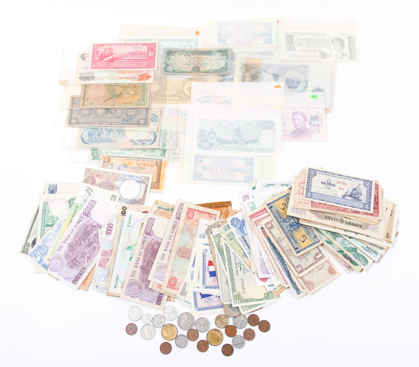 WORLD PAPER CURRENCY & COINS 20th C. - LOT OF 160+: WORLD PAPER CURRENCY & COINS 20th C. - LOT OF 160+ Large lot of paper currency and coins from around the world, dated 1900's to 1990's. Includes France, Vietnam, Australia, Italy, Mexico, Bahamas, Can