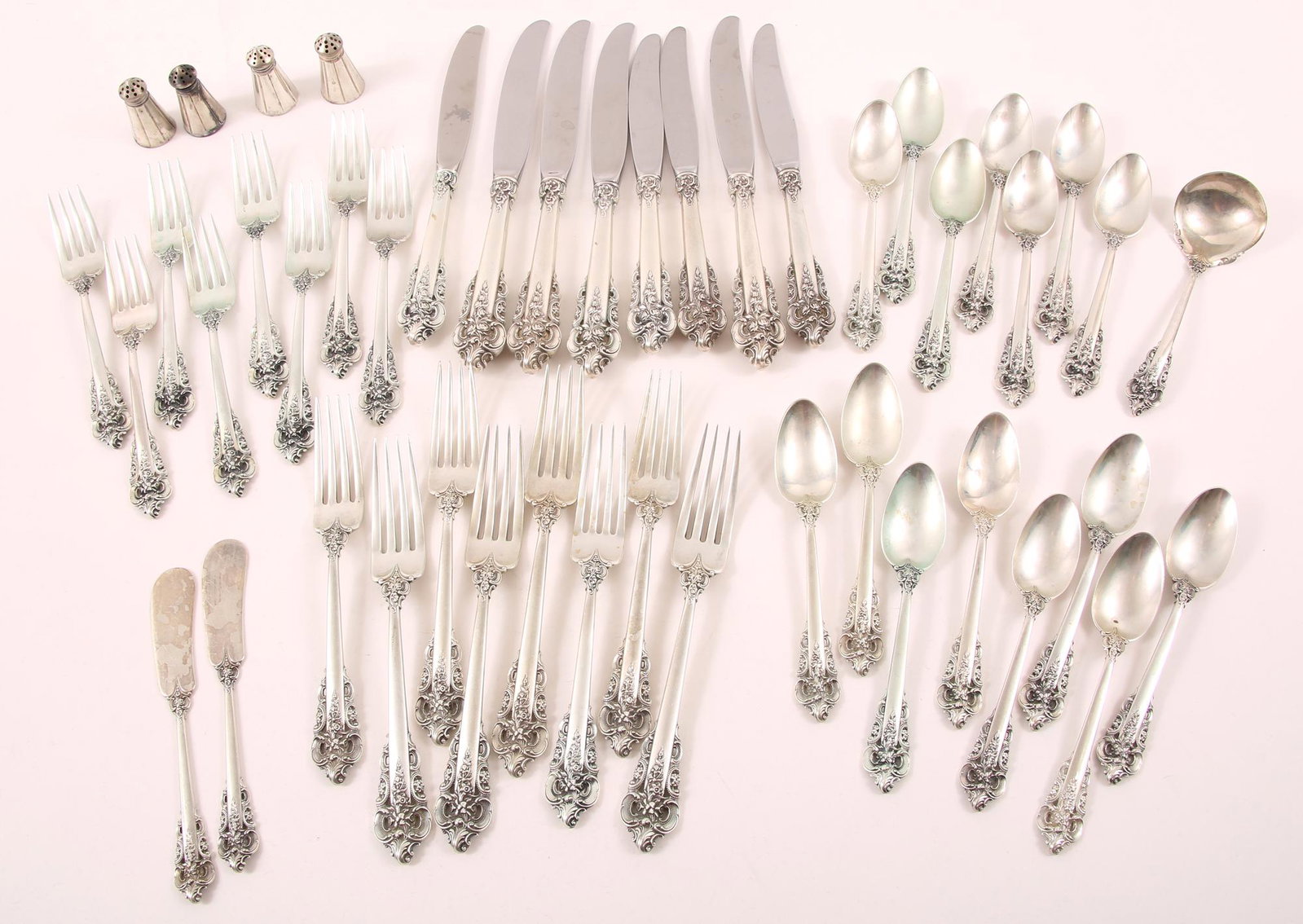 WALLACE STERLING SILVER GRANDE BAROQUE FLATWARE: WALLACE STERLING SILVER GRANDE BAROQUE FLATWARE Wallace sterling silver flatware in Grande Baroque pattern. Includes: 4 salt & pepper shakers 15 tea spoons 8 dinner forks 8 salad forks<
