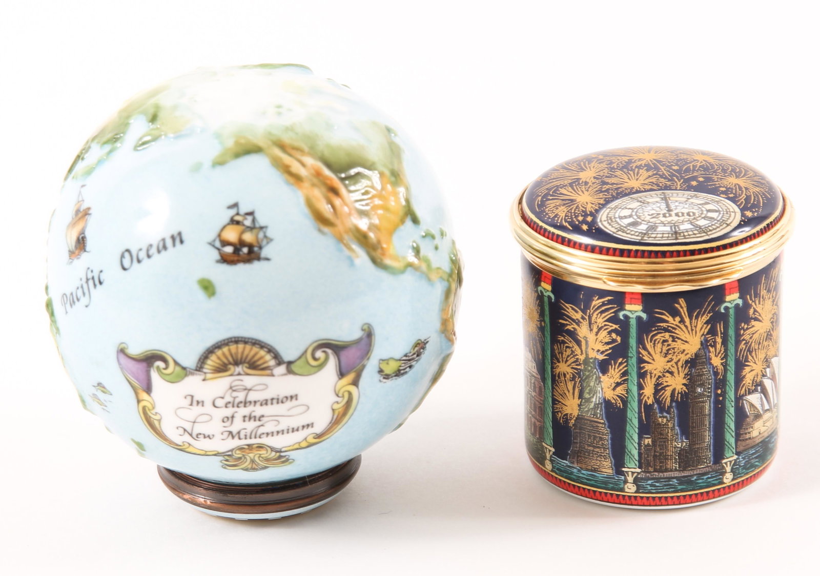 HALCYON DAYS ENAMELS MILLENNIUM TRINKET BOXES: HALCYON DAYS ENAMELS MILLENNIUM TRINKET BOXES Lot of 2 millennium Halcyon Days Enamels, including: "In celebration of the dawn of the 21st century," with images of fireworks along the skyline of Agra,