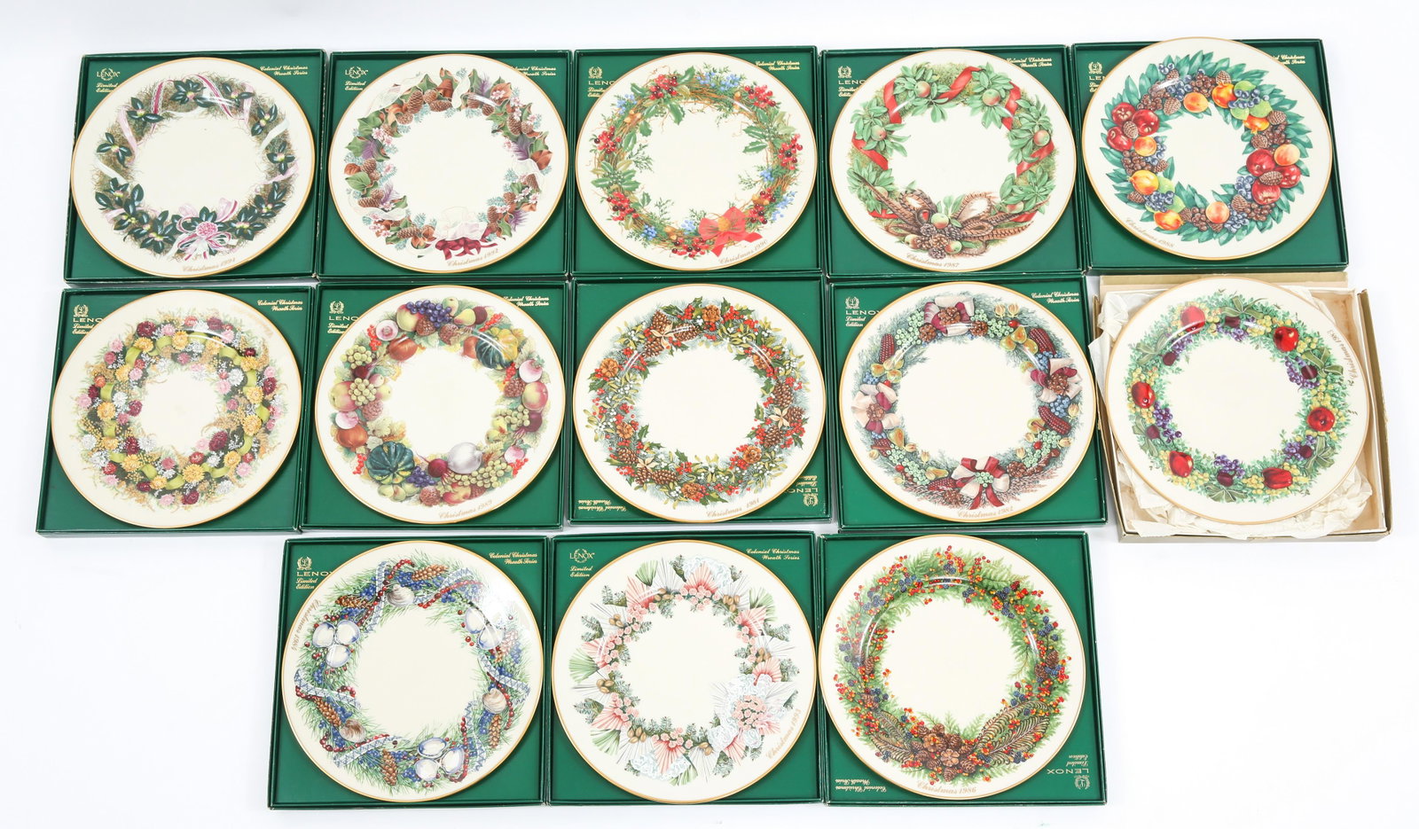 LENOX PORCELAIN COLONIAL CHRISTMAS COLLECTORS PLATES: LENOX PORCELAIN COLONIAL CHRISTMAS COLLECTORS PLATES Thirteen Lenox porcelain Colonial Christmas collectors plates with boxes, to include 1982-1988, (2) 1989, 1990-1993. Size: 8"