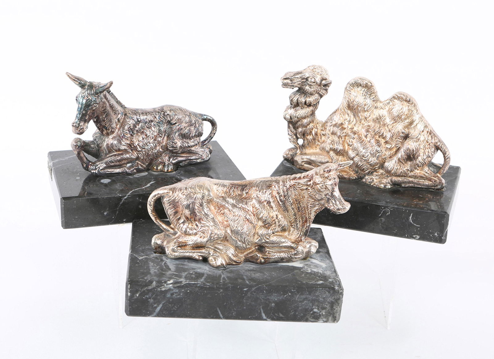 YAACOV HELLER STERLING SILVER NATIVITY ANIMAL STATUES -: YAACOV HELLER STERLING SILVER NATIVITY ANIMAL STATUES - LOT OF 3 Yaacov Heller (Israel, b.1941) sterling silver statues of Nativity camel, cow, and donkey attached to marble bases. Lot of 3. Size: 6.2