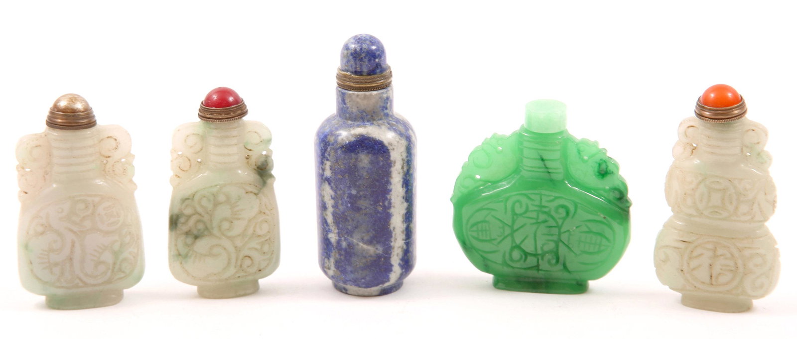 CHINESE CARVED STONE SNUFF BOTTLES - LOT OF 5: CHINESE CARVED STONE SNUFF BOTTLES - LOT OF 5 Lot of five Chinese carved snuff bottles, includes: Sodalite, 3.25" 2 - Softstone with carnelian lid, 2.5" and 2.75" Softstone with white medal lid, 2.75"