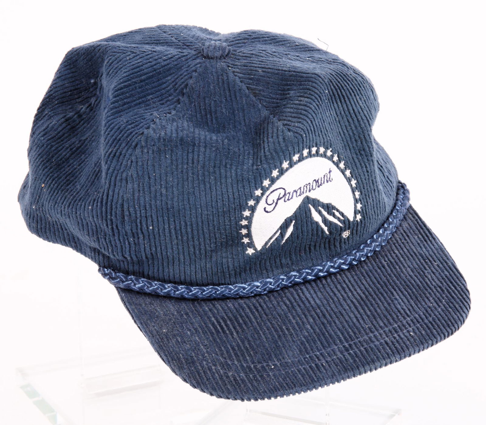 1980S PARAMOUNT STUDIOS CORDUROY TRUCKER HAT: 1980S PARAMOUNT STUDIOS CORDUROY TRUCKER HAT 1980s Paramount studios navy blue corduroy trucker hat with adjustable slide closure. Made by Sportcap Supreme. Size:Adjustable