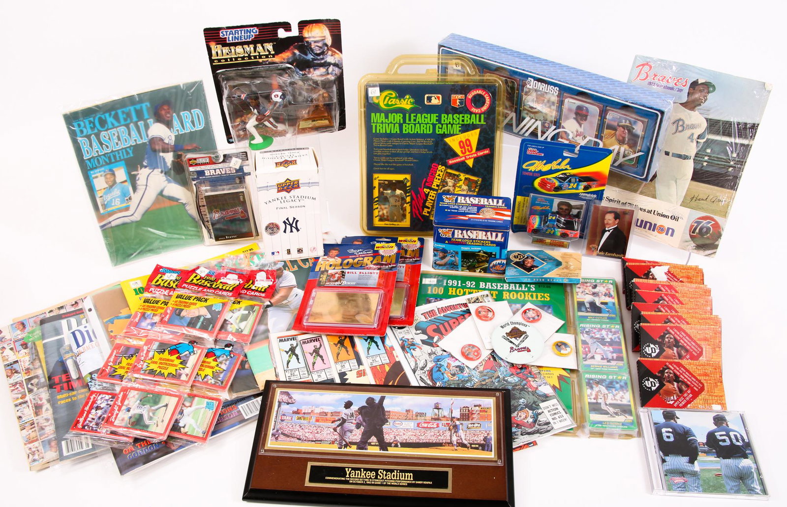 SPORTS MEMORABILIA - CARDS, TOYS, MAGAZINES: SPORTS MEMORABILIA - CARDS, TOYS, MAGAZINES Mixed lot of basketball, football, baseball, and racing memorabilia. Includes trading cards, board games, toys, puzzles, magazines, photographs, and card co