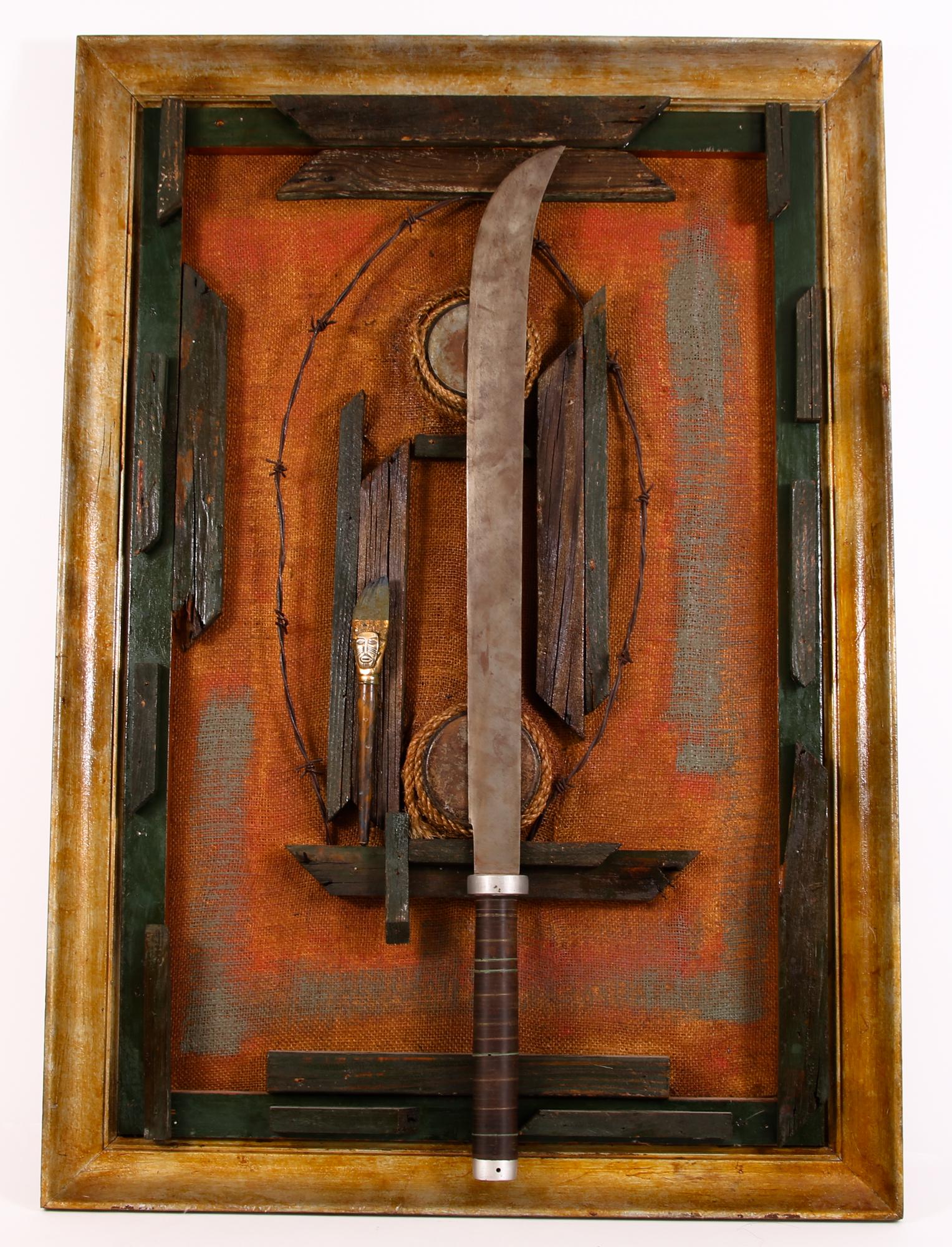 MIXED MEDIA BRUTALIST SWORD WALL SCULPTURE ART: MIXED MEDIA BRUTALIST SWORD WALL SCULPTURE ART Framed Brutalist wall sculpture made of wood, barbed wire, and other found objects. Sword at center is detachable by a pair of magnets. No signature. Siz
