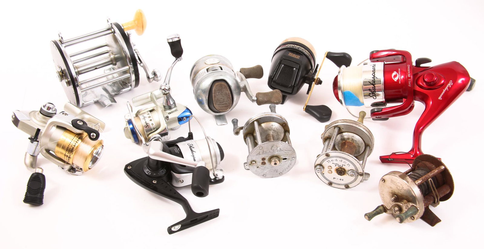 FISHING REELS - LOT OF 10: FISHING REELS - LOT OF 10 Lot of 10 fishing reels, including: Browing Superlight. Daiwa Sweepfire 2000B. Bronson Mercury with engravings on the side. Heddon "Pal" P-41. (2) Shakespeare. Ocea