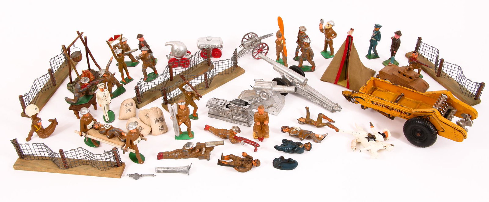WWI TOY SOLDIERS, VEHICLES, FIELD EQUIPMENT & WEAPONS: WWI TOY SOLDIERS, VEHICLES, FIELD EQUIPMENT & WEAPONS Lot of Manoil, Barclay, and Arcade WWI toy soldiers and miniature diorama props, includes: Lead and ceramic soldiers