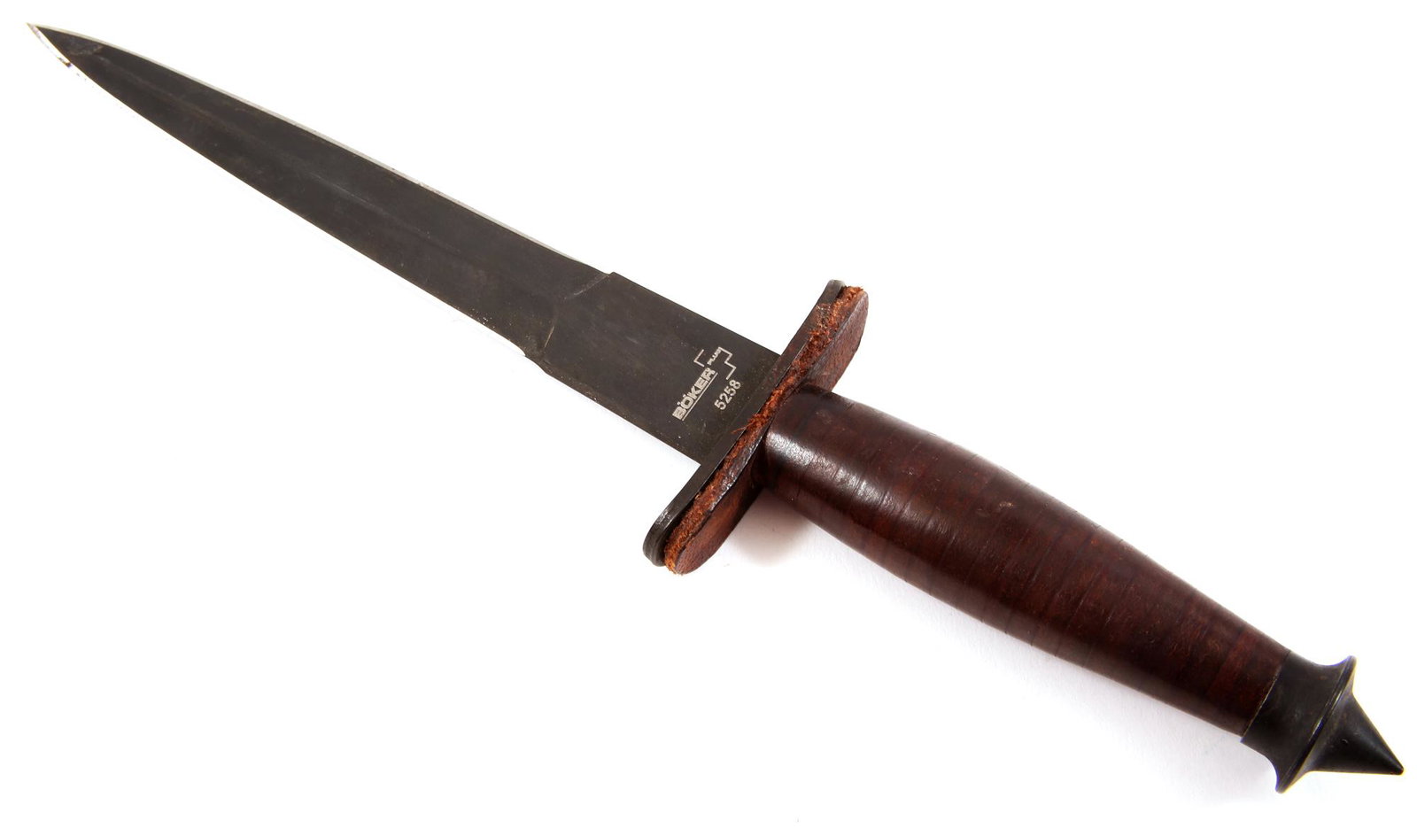 BOKER PLUS V-42 "DEVIL'S BRIGADE" REPLICA FIGHTER KNIFE: BOKER PLUS V-42 "DEVIL'S BRIGADE" REPLICA FIGHTER KNIFE Historical replica of WWII V-42 "Devil's Brigade" fighter dagger knife, with leather handle and serrated thumb rest on tang. Blade length: 7". O
