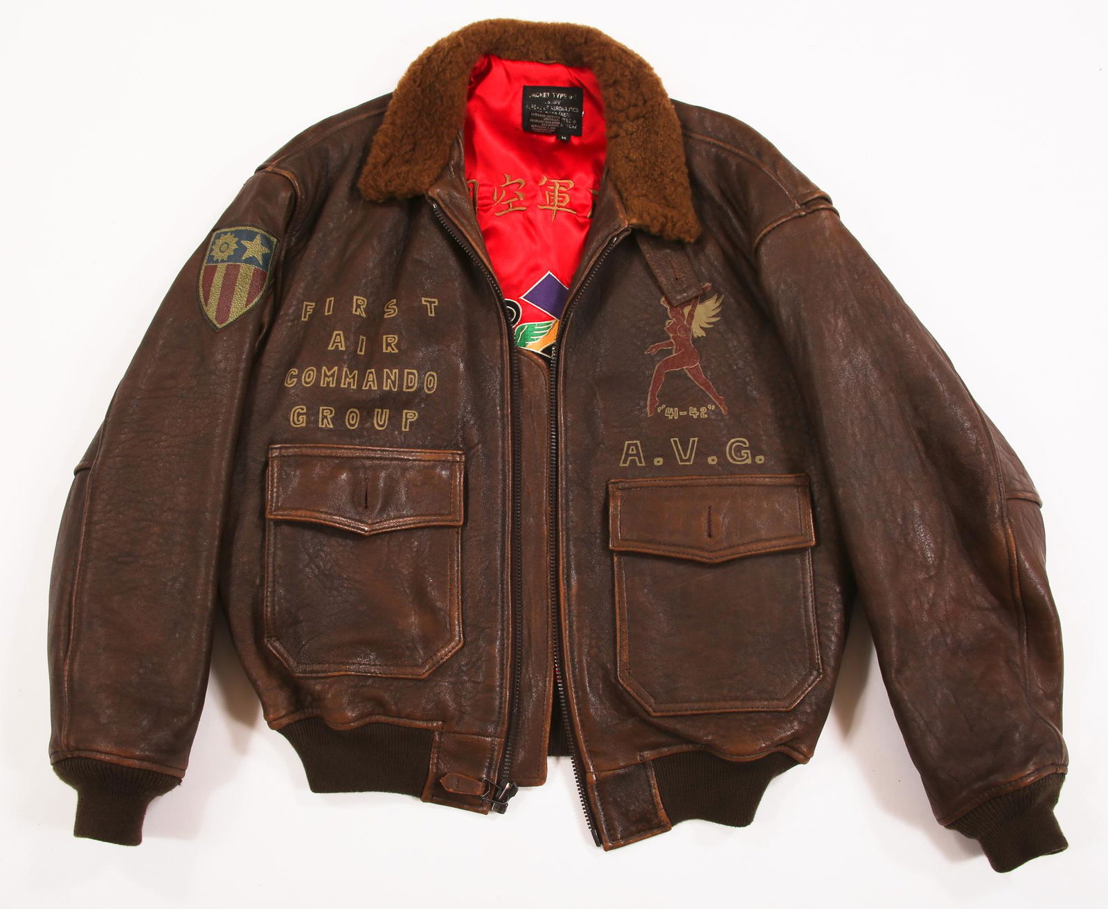 WWII FLYING TIGER REPRODUCTION G-1 LEATHER BOMBER: WWII FLYING TIGER REPRODUCTION G-1 LEATHER BOMBER JACKET 1980s reproduction of a WWII Flying Tiger (First American Volunteer Group, AVG) leather bomber jacket with patches and embroidered lining, made