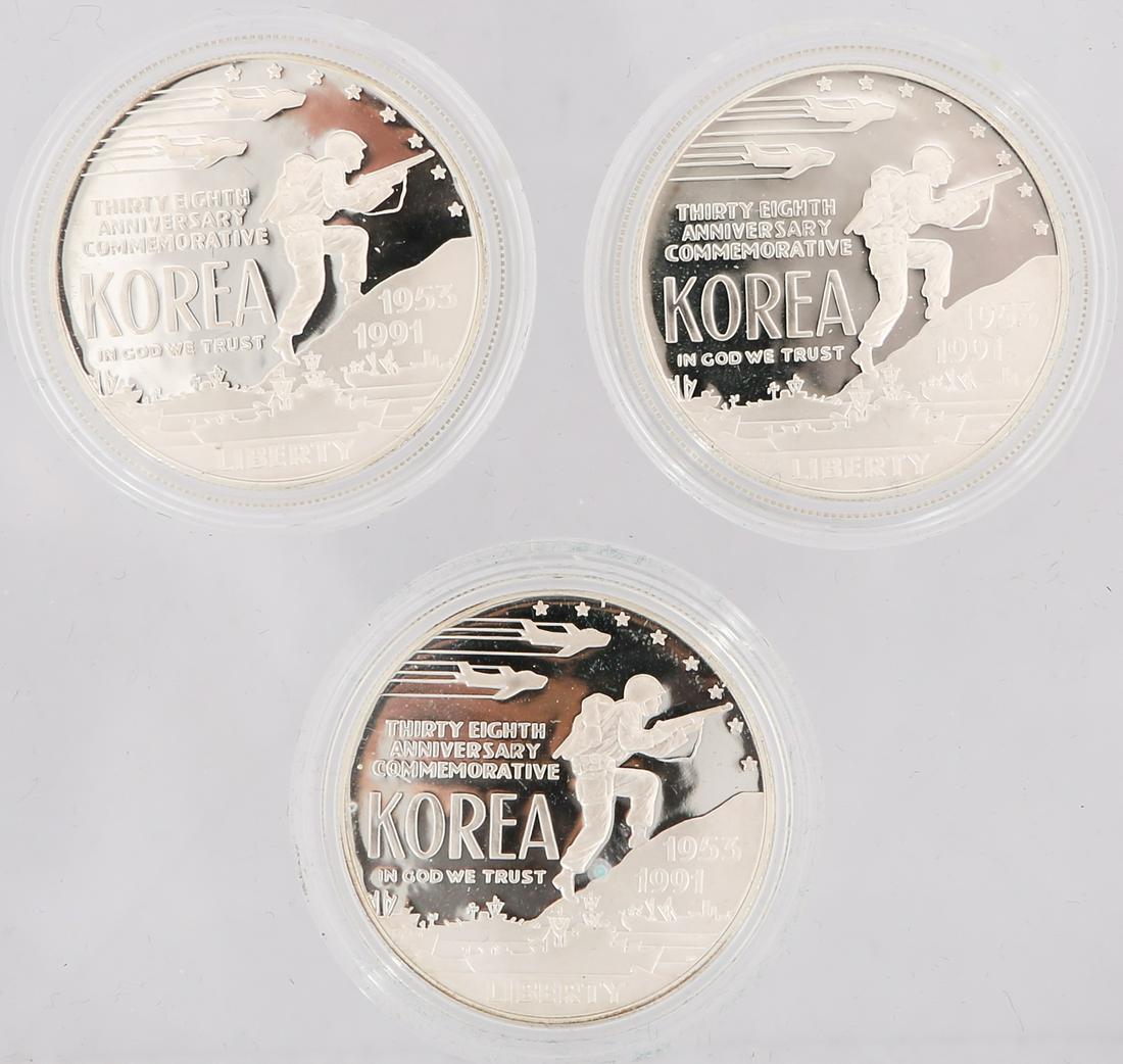 U.S. KOREAN WAR MEMORIAL SILVER DOLLARS - LOT OF 3: U.S. KOREAN WAR MEMORIAL SILVER DOLLARS - LOT OF 3 Lot of three 1991 United States Korean War Memorial Commemorative silver dollars, each accompanied by boxes and paperwork. Weight: 26.7 grams