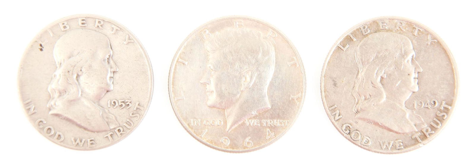 1949-1964 US SILVER FRANKLIN & KENNEDY HALF DOLLARS: 1949-1964 US SILVER FRANKLIN & KENNEDY HALF DOLLARS Lot of three US silver 50 cent coins to include: 1949 and 1953 Franklin half dollars, and 1964 Kennedy half dollar, 90% silver. Weight: 37g total