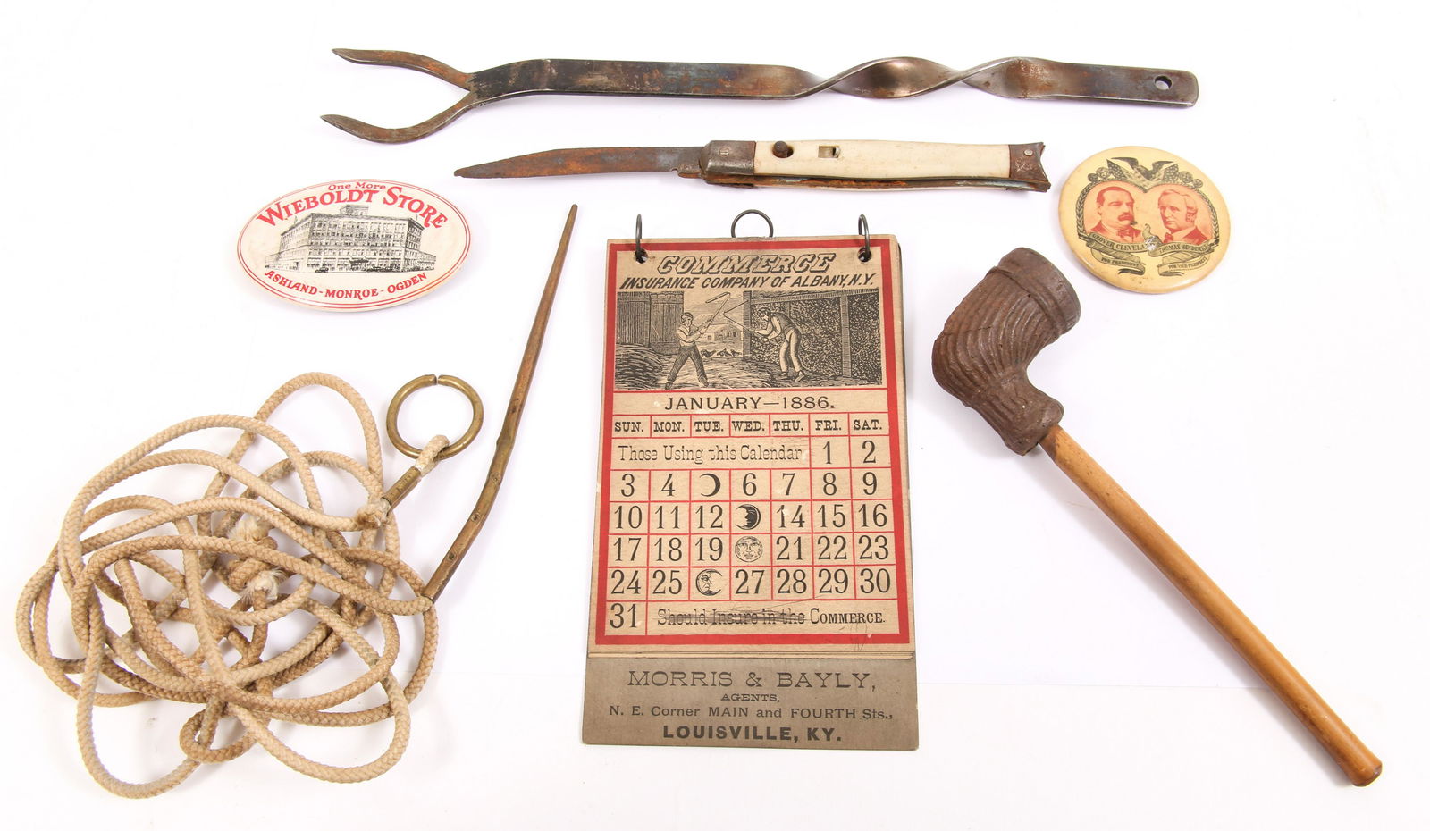 CLAY PIPE, POCKET KNIFE, POLITICAL BUTTON, & MORE: CLAY PIPE, POCKET KNIFE, POLITICAL BUTTON, & MORE Mixed lot of late 19th and early 20th century estate items, to include a clay pipe, Grover Cleveland political button, novelty Wieboldt Store match st
