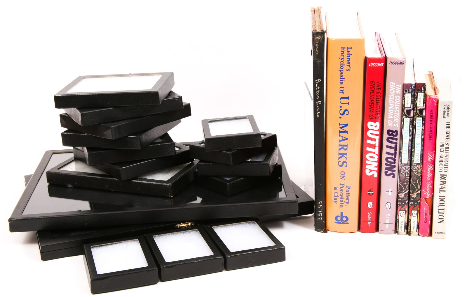 REFERENCE BOOKS & RIKER MOUNT DISPLAYS: REFERENCE BOOKS & RIKER MOUNT DISPLAYS Lot of reference books, and riker mount displays: Books: Button Button Identification & Price Guide by Peggy Ann Osborne The Button Sampler by Lillian Smith 