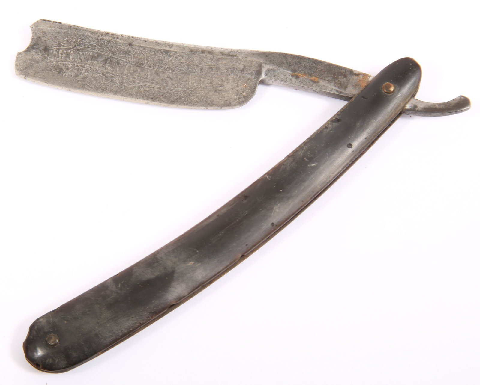WADE & BUTCHER SHEFFIELD STRAIGHT RAZOR & CASE: WADE & BUTCHER SHEFFIELD STRAIGHT RAZOR & CASE Wade & Butcher Sheffield, England straight razor with case, marked on tang. Engraved "FINE INDIA STEEL" on blade decorated with scrolling pattern. Si