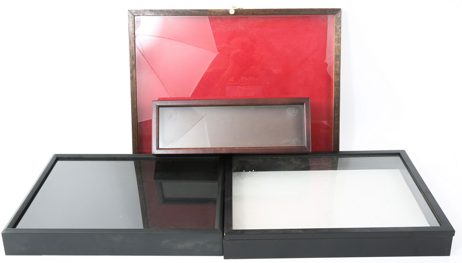 DISPLAY CASES & SHADOW BOXES - LOT OF 4: DISPLAY CASES & SHADOW BOXES - LOT OF 4 Lot of four display cases, to include sizes: 25 x 19" display case. 20.75 x 16.75 x 2.5" shadow box. 21 x 17 x 2.75" shadow box. 6.25 x 18.25" Colt