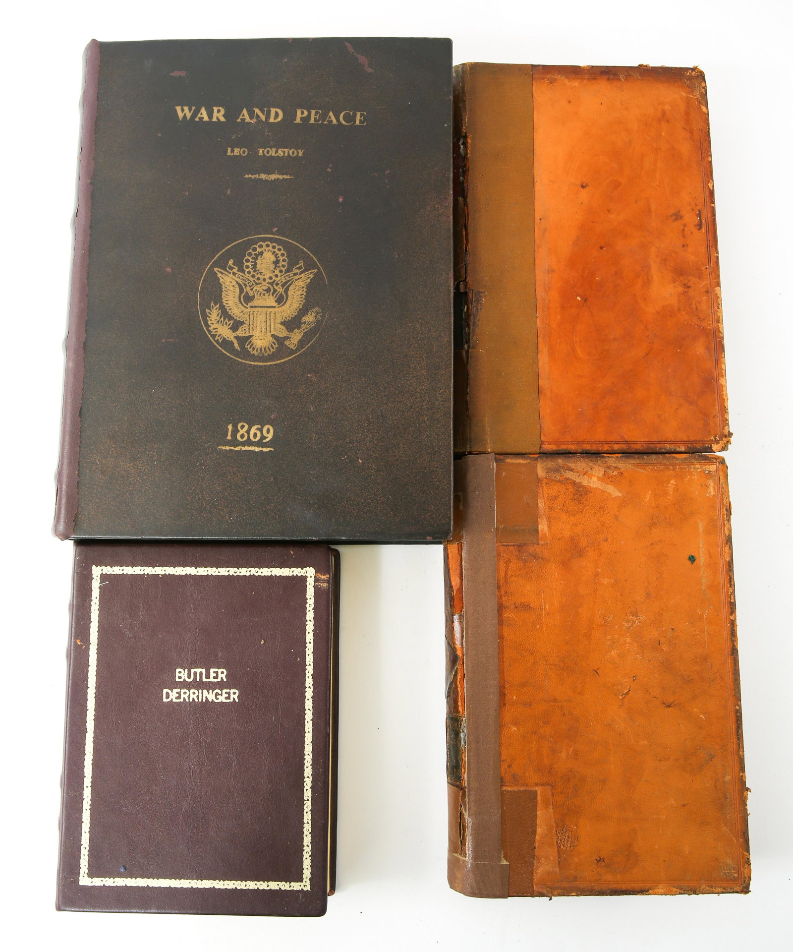 SECRET STORAGE BOOK PISTOL BOXES - LOT OF 4: SECRET STORAGE BOOK PISTOL BOXES - LOT OF 4 Lot of four secret storage book boxes, includes a "Butler Derringer" fitted velvet lined box, 8 x 6", two handmade boxes, one includes leather divider for p