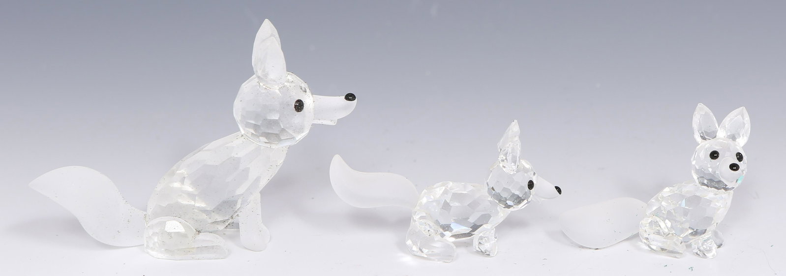 SWAROVSKI SCS CRYSTAL FOX FIGURINES - LOT OF 3: SWAROVSKI SCS CRYSTAL FOX FIGURINES - LOT OF 3 Lot of 3 Swarovski silver crystal fox figurines. Includes: SCS Sitting Fox, 1.75". SCS Standing Fox, 2". Sitting Fox, 2.50".