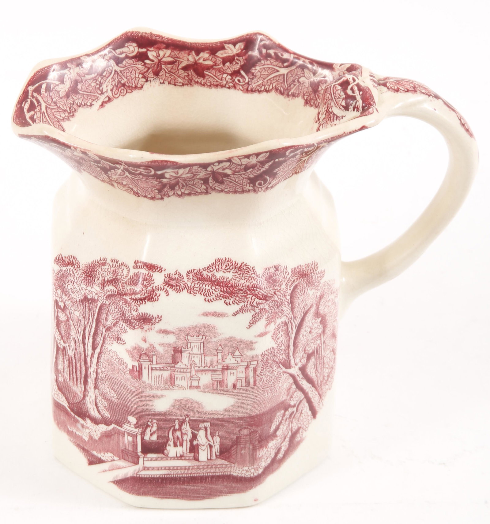 MASON'S IRONSTONE VISTA ENGLAND PITCHER IN RED: MASON'S IRONSTONE VISTA ENGLAND PITCHER IN RED Mason's ironstone china pitcher with Vista England design in red. The pitcher shows people walking together on the grounds of a castle. The rim of the pi