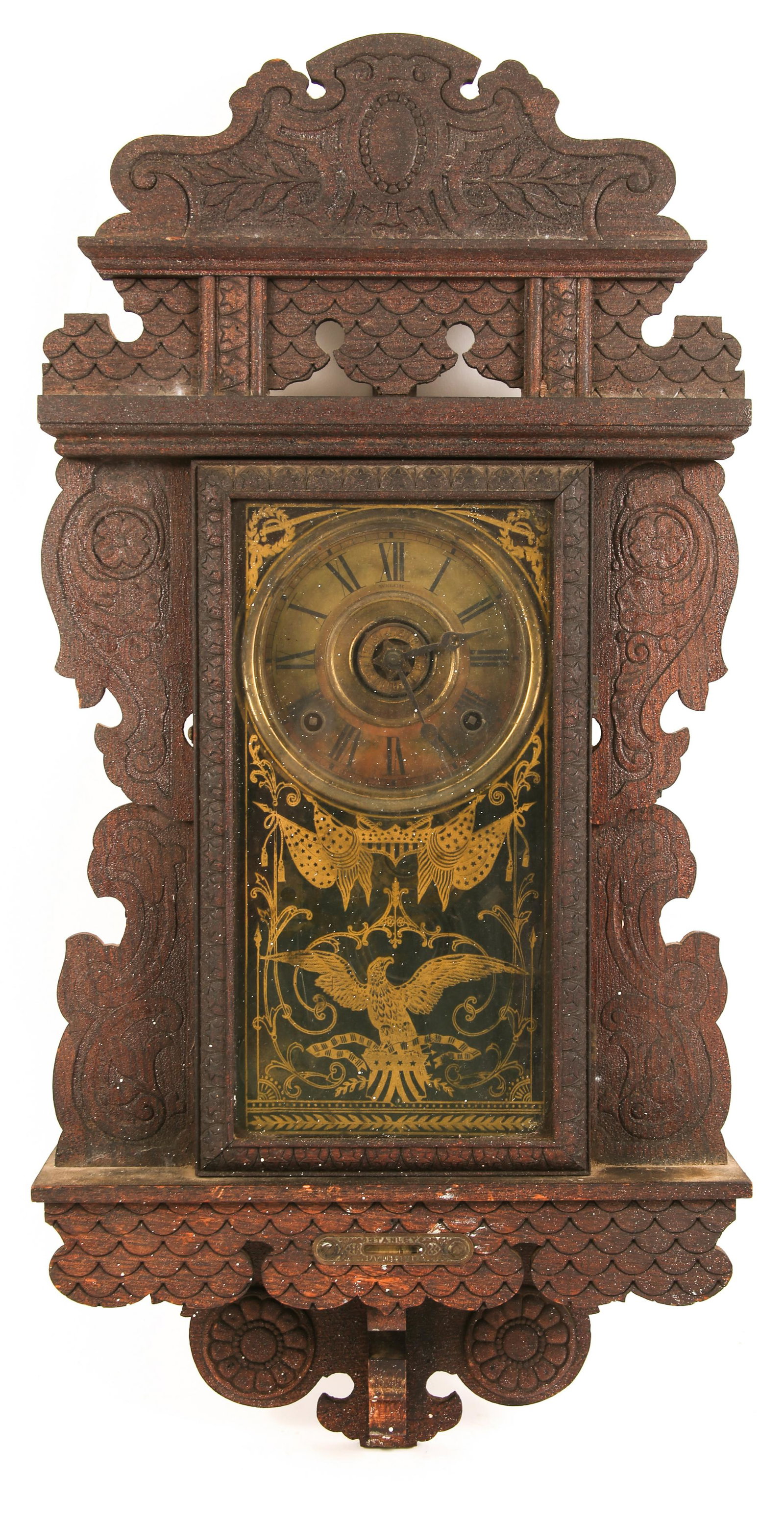 LATE 19TH CENTURY E.N. WELCH WOODEN WALL CLOCK: LATE 19TH CENTURY E.N. WELCH WOODEN WALL CLOCK Late 19th century E.N. Welch wooden wall clock with Roman numerals and Stanley mounted level. The glass door is accented with a gold painted eagle a