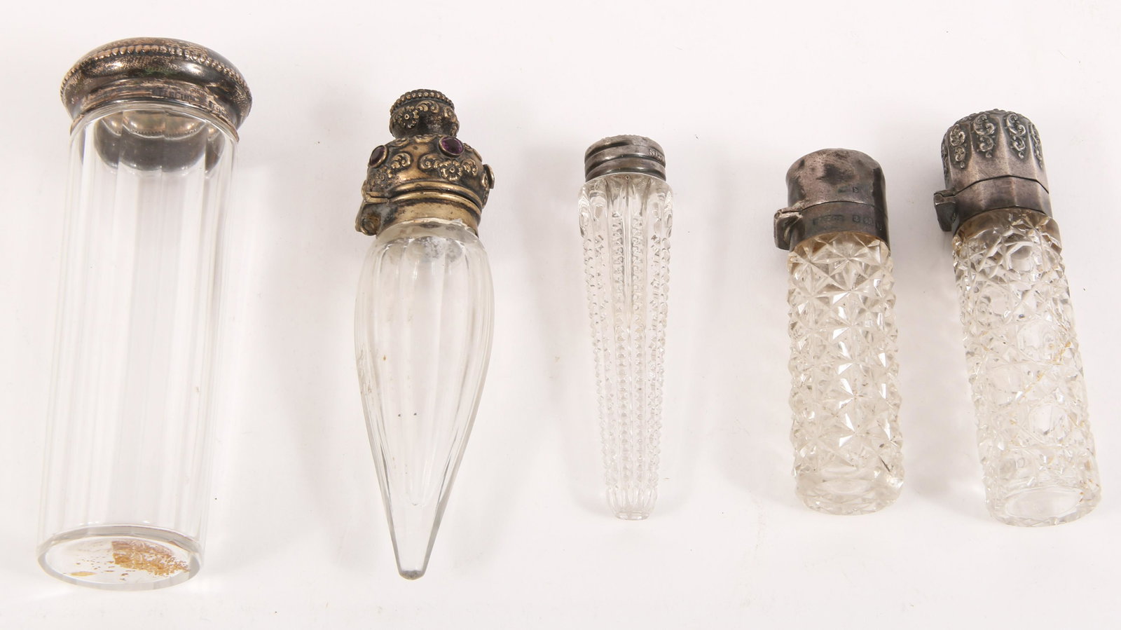 EARLY 20TH C. STERLING CAPPED PERFUME VIALS - LOT OF 5: EARLY 20TH C. STERLING CAPPED PERFUME VIALS - LOT OF 5 Lot of 5 early 20th century sterling silver capped glass perfume vials. Includes: Cylindrical vial with cap stamped "925," "Birmingham" and "1901