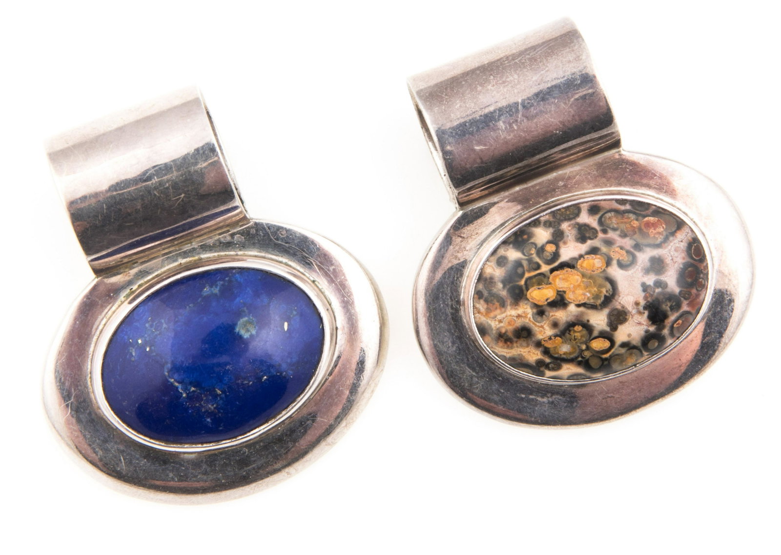 TAXCO STERLING SILVER PENDANTS - JASPER & LAPIS LAZULI: TAXCO STERLING SILVER PENDANTS - JASPER & LAPIS LAZULI Lot of two sterling silver Taxco pendants, to include: Leopardskin jasper, 22 x 30 mm, TV-40. Lapis lazuli, 20 x 2