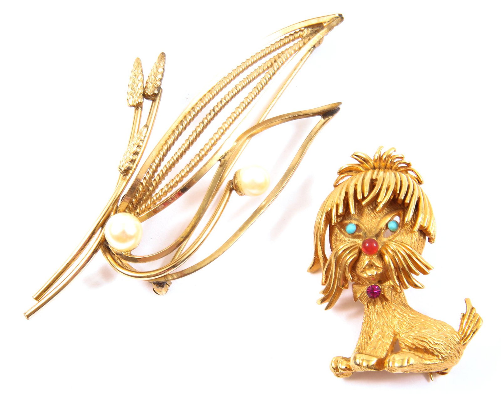 COROCRAFT AND ALICE CAVINESS BROOCHES - LOT OF 2: COROCRAFT AND ALICE CAVINESS BROOCHES - LOT OF 2 Lot of 2 women's brooches, including: Corocraft dog brooch decorative gemstone accents on the eyes, nose and bowtie; 1.5 x 1.25 inches.