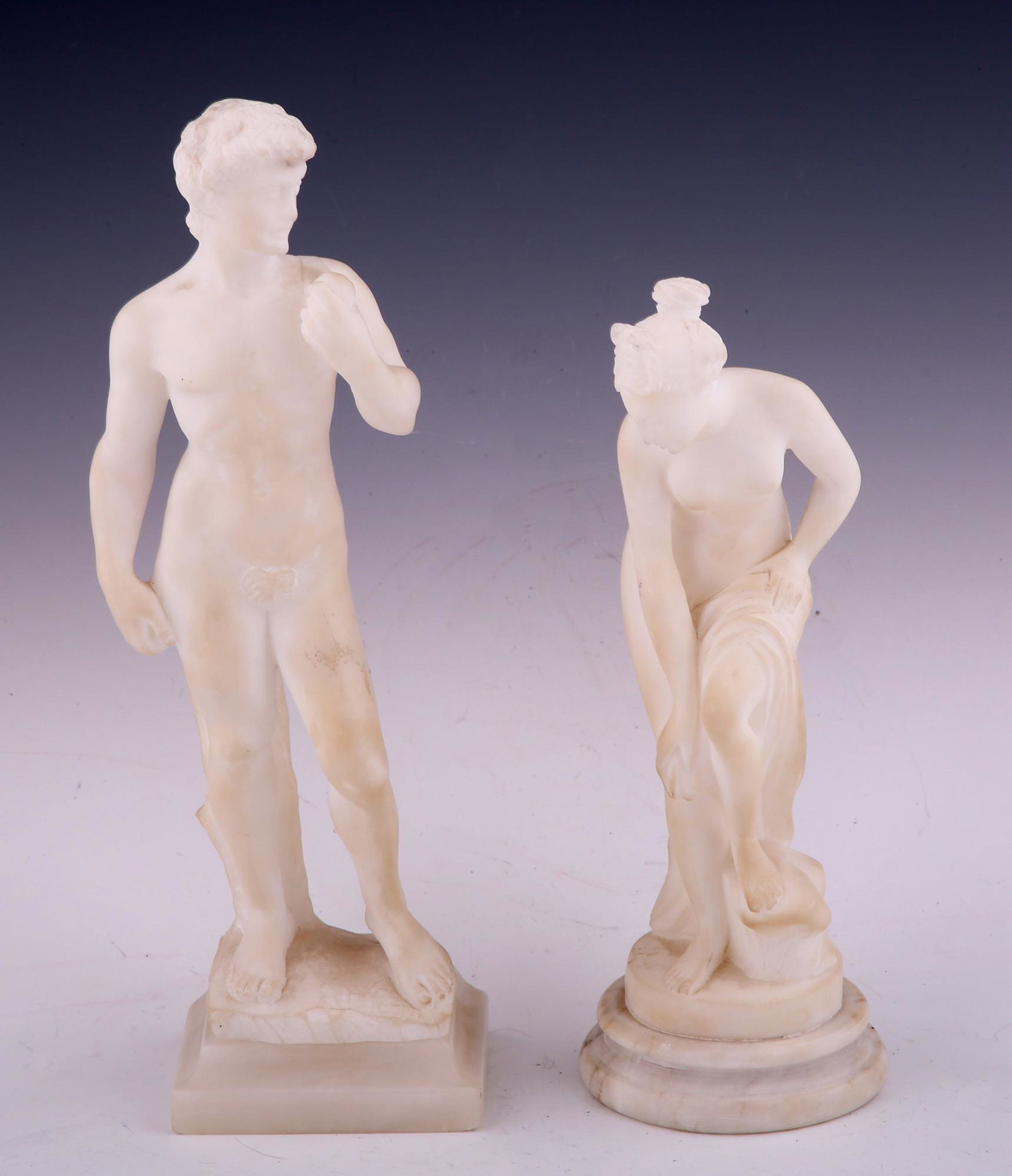 REPLICA DAVID & APHRODITE MINI ALABASTER STATUETTES: REPLICA DAVID & APHRODITE MINI ALABASTER STATUETTES Lot of 2 miniature replica alabaster statuettes. Includes: Michelangelo's David. Height: 10". Bathing Venus Aphrodite. Height: 8.5".