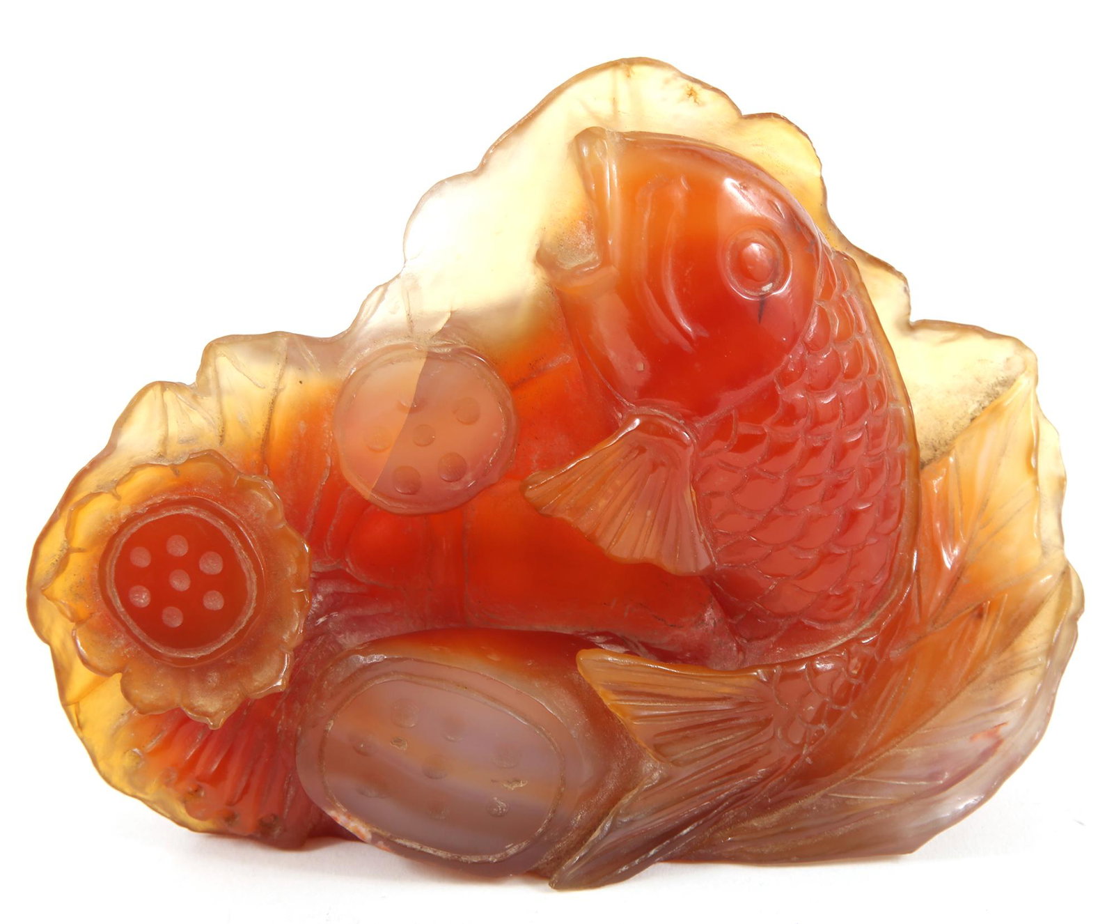 CHINESE CARVED CARNELIAN AGATE FISH FIGURINE: CHINESE CARVED CARNELIAN AGATE FISH FIGURINE Chinese carnelian agate carved fish figurine. Size: 5.75 x 1.75 x 4.5"