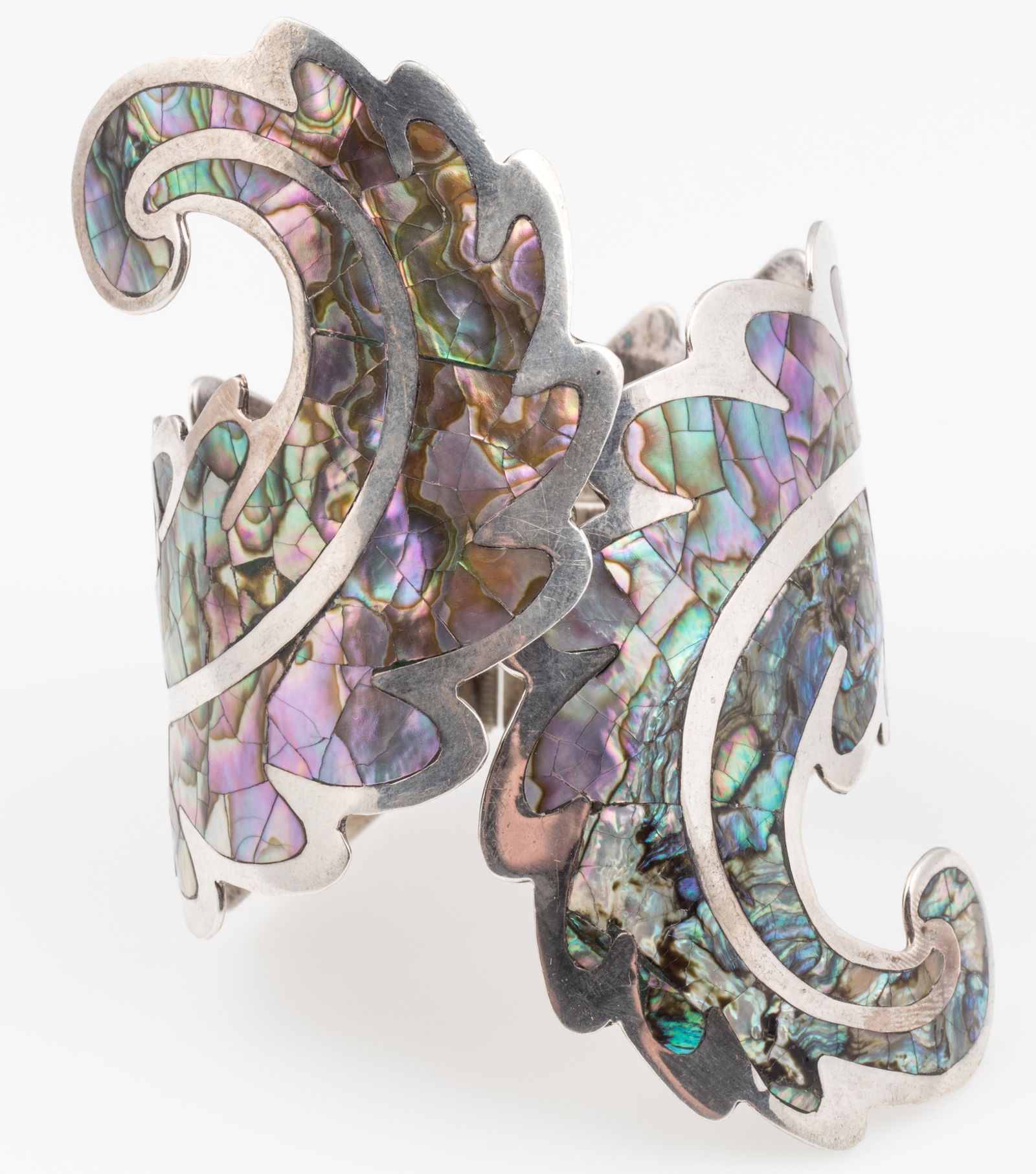 TAXCO LOS BALLESTEROS STERLING CLAMPER CUFF BRACELET: TAXCO LOS BALLESTEROS STERLING CLAMPER CUFF BRACELET 1960s Taxco sterling silver clamper cuff feather design bracelet, abalone shell inlay, made in Mexico. Stamped with Talleres de los Ballesteros mak