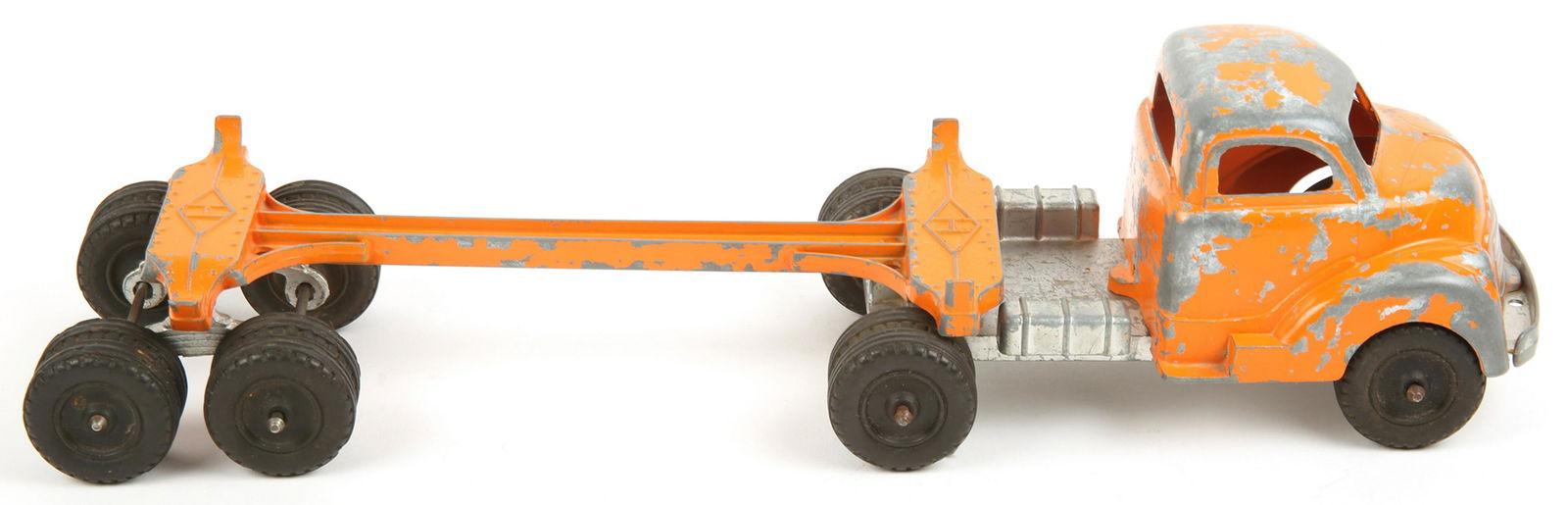 HUBLEY USA TOY ORANGE LOG TRUCK & TRAILER: HUBLEY USA TOY ORANGE LOG TRUCK & TRAILER A mid 20th century Hubley kiddie toy painted orange metal truck and trailer. Size: 16"