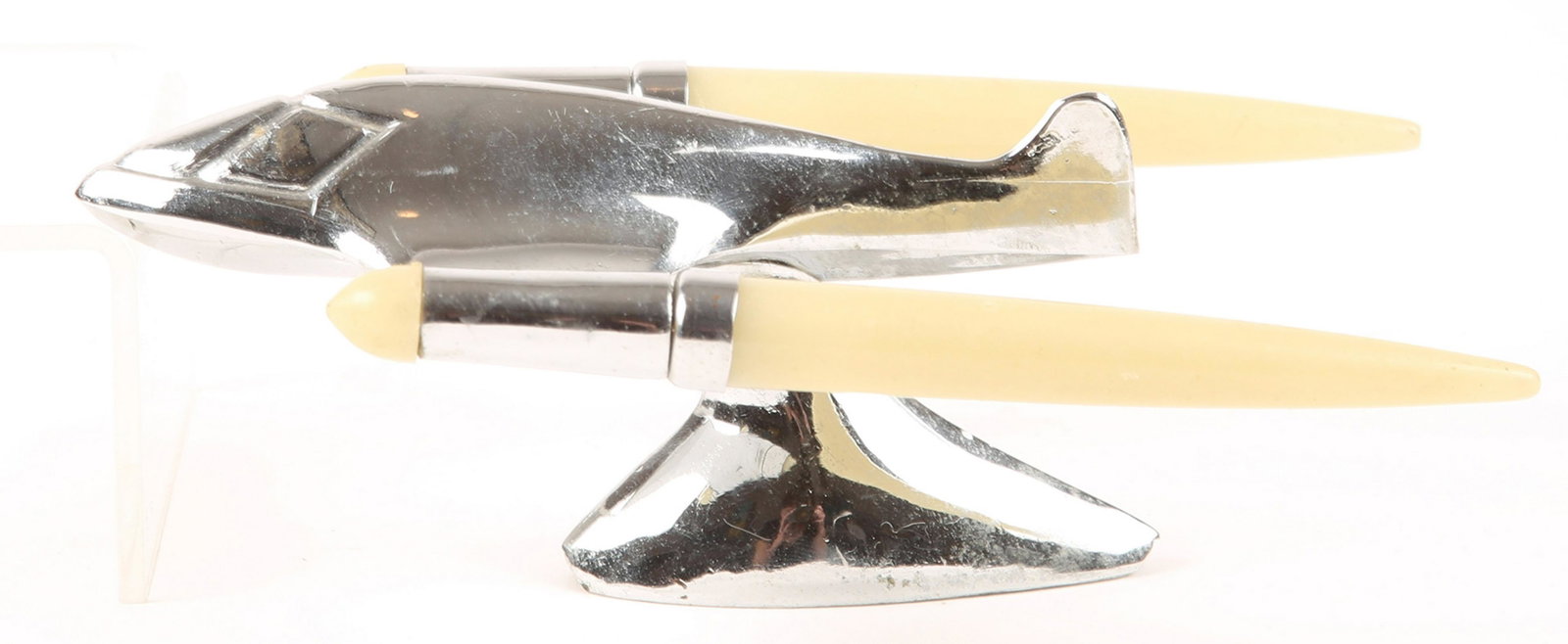 OLDSMOBILE AIRPLANE JET CHROME HOOD ORNAMENT: OLDSMOBILE AIRPLANE JET CHROME HOOD ORNAMENT An art deco chrome plated 1950s Oldsmobile jet plane figure hood ornament, plastic inserts at wings. Size: 6"