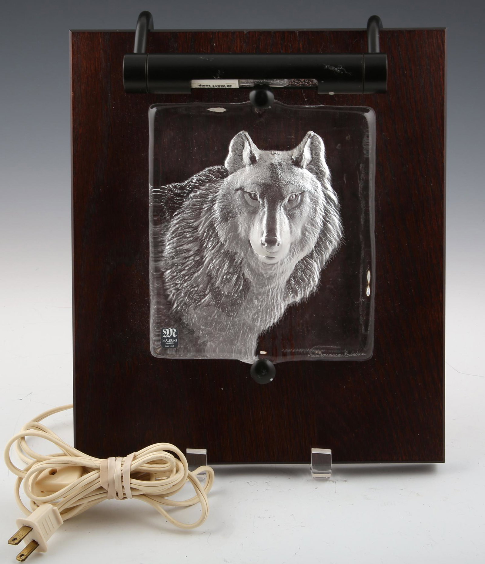 MATS JONASSON CRYSTAL WOLF SCULPTURE MOUNTED ON WOOD: MATS JONASSON CRYSTAL WOLF SCULPTURE MOUNTED ON WOOD Mats Jonasson crystal wolf sculpture mounted on wood. Signed by the artist on the bottom right of glass. Includes Maleras Sweden sticker on the bot