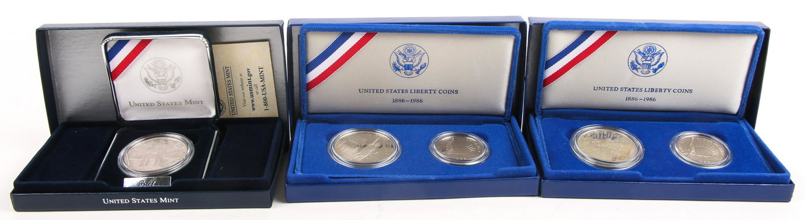 COMMEMORATIVE SILVER PROOF COIN SETS - LOT OF 3: COMMEMORATIVE SILVER PROOF COIN SETS - LOT OF 3 To include two 1986 Liberty 2 coin sets, and one Lewis and Clark Bicentennial silver dollar.