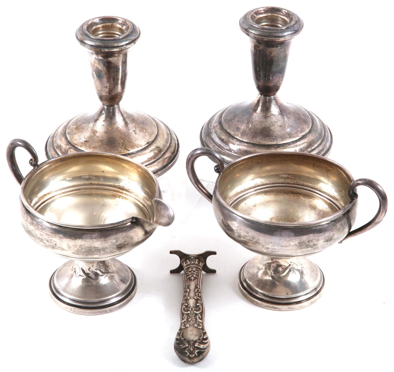 STERLING SILVER CANDLESTICKS, SUGAR & CREAMER, & MORE: STERLING SILVER CANDLESTICKS, SUGAR & CREAMER, & MORE Sterling silver items to include: Towle weighted candlesticks, 4" Weighted sugar and creamer set, 3.75", marked on underside. Se