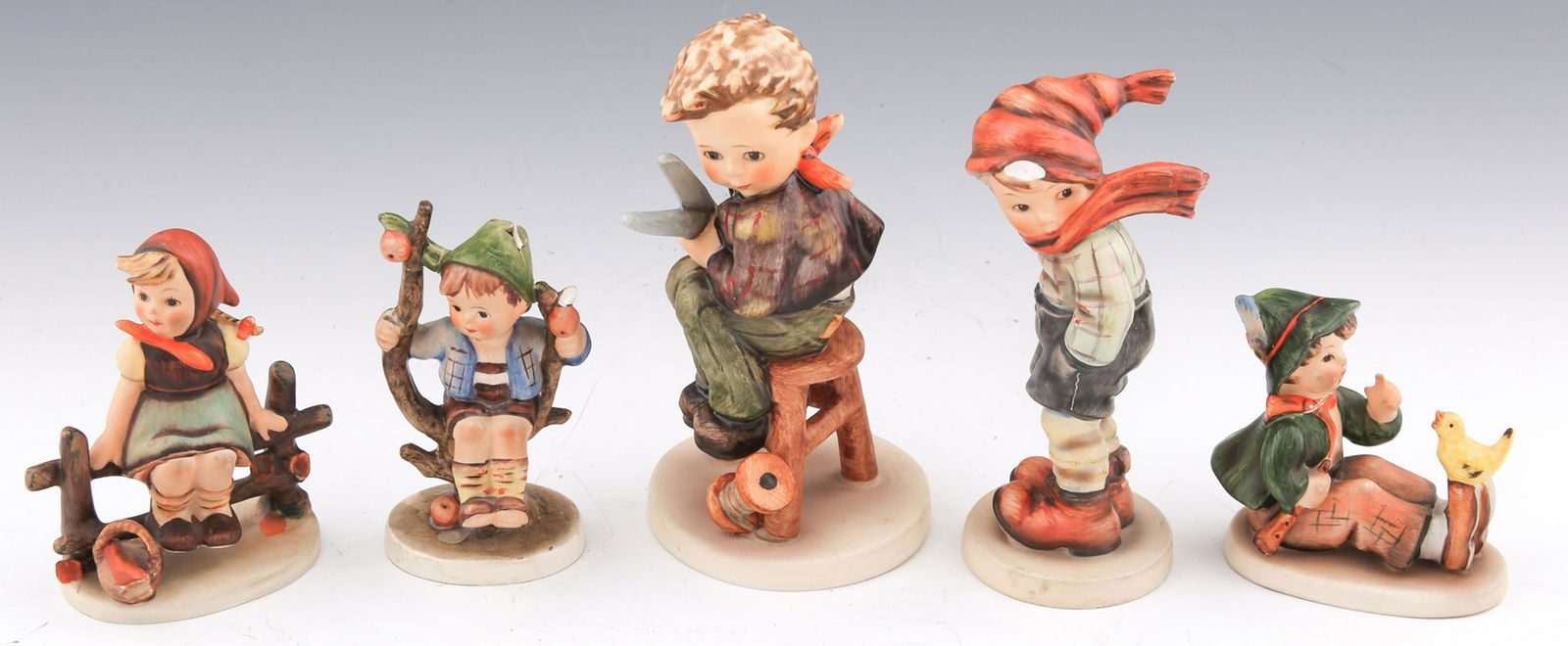 GOEBEL HUMMEL PORCELAIN FIGURINES: GOEBEL HUMMEL PORCELAIN FIGURINES Goebel Hummel porcelain figurines, includes: Just Resting, 3.75" Apple Tree Boy, 4" Little Tailor, 5.75" March Winds, 5.5" Singing Lesson, 3" <