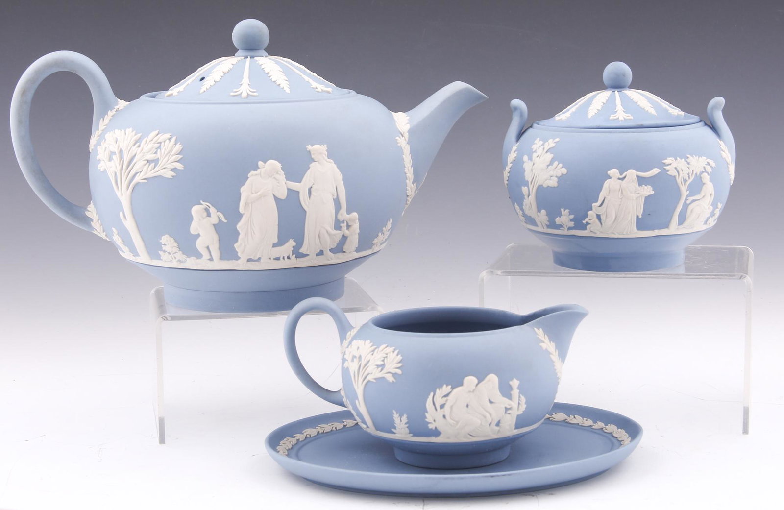 WEDGWOOD JASPERWARE TEAPOT, SUGAR, CREAMER & SAUCER: WEDGWOOD JASPERWARE TEAPOT, SUGAR, CREAMER & SAUCER Wedgwood jasperware teapot, 9 x 6 x 5", sugar and creamer, and saucer, 6.5 x 5". 