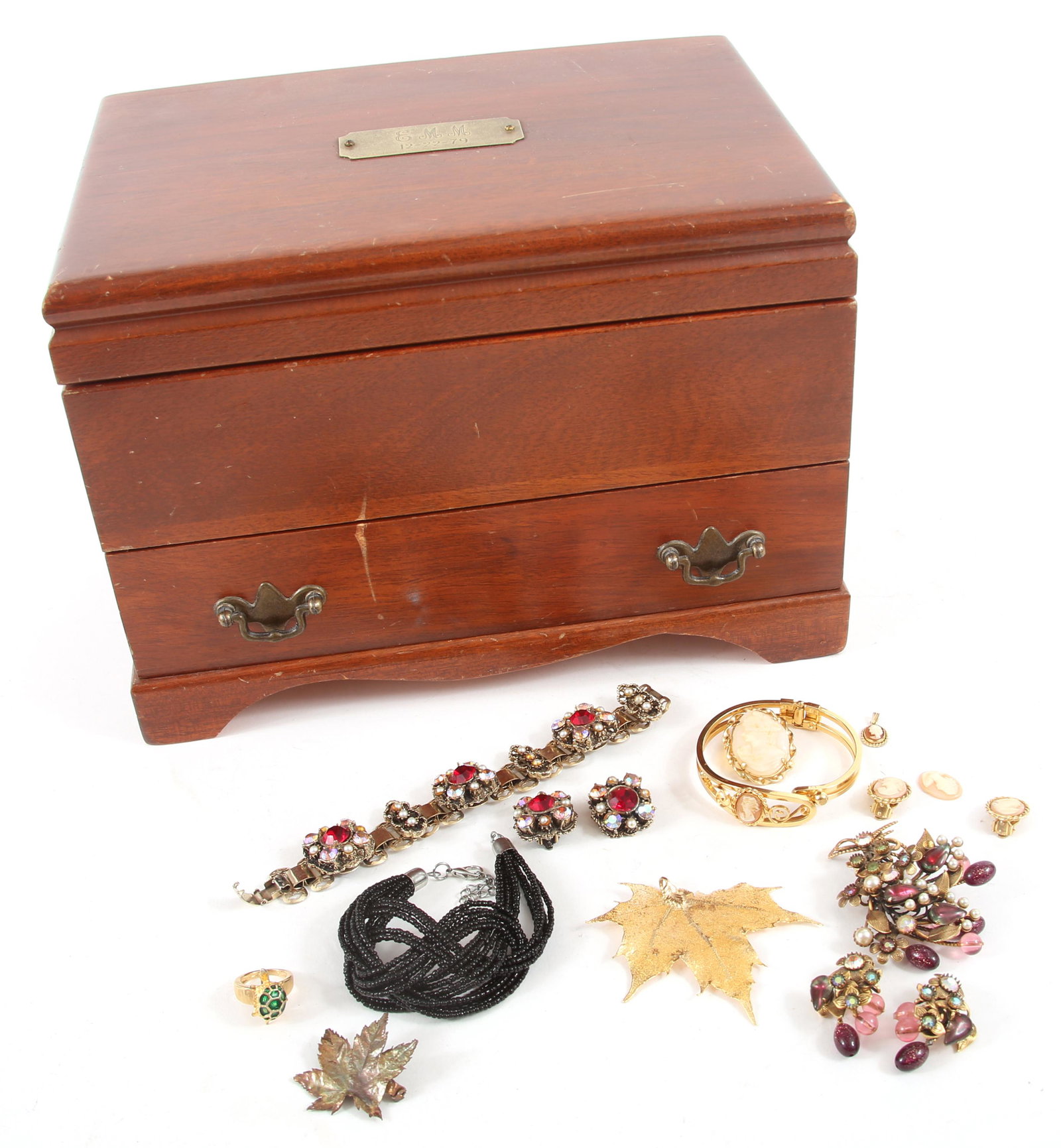 COSTUME JEWELRY & JEWELRY BOX: COSTUME JEWELRY & JEWELRY BOX Costume jewelry brooches, earrings, bracelets, and cameo pieces. Includes personalized wooden jewelry box with a single drawer and false bottom, green velvet lining. Plaq