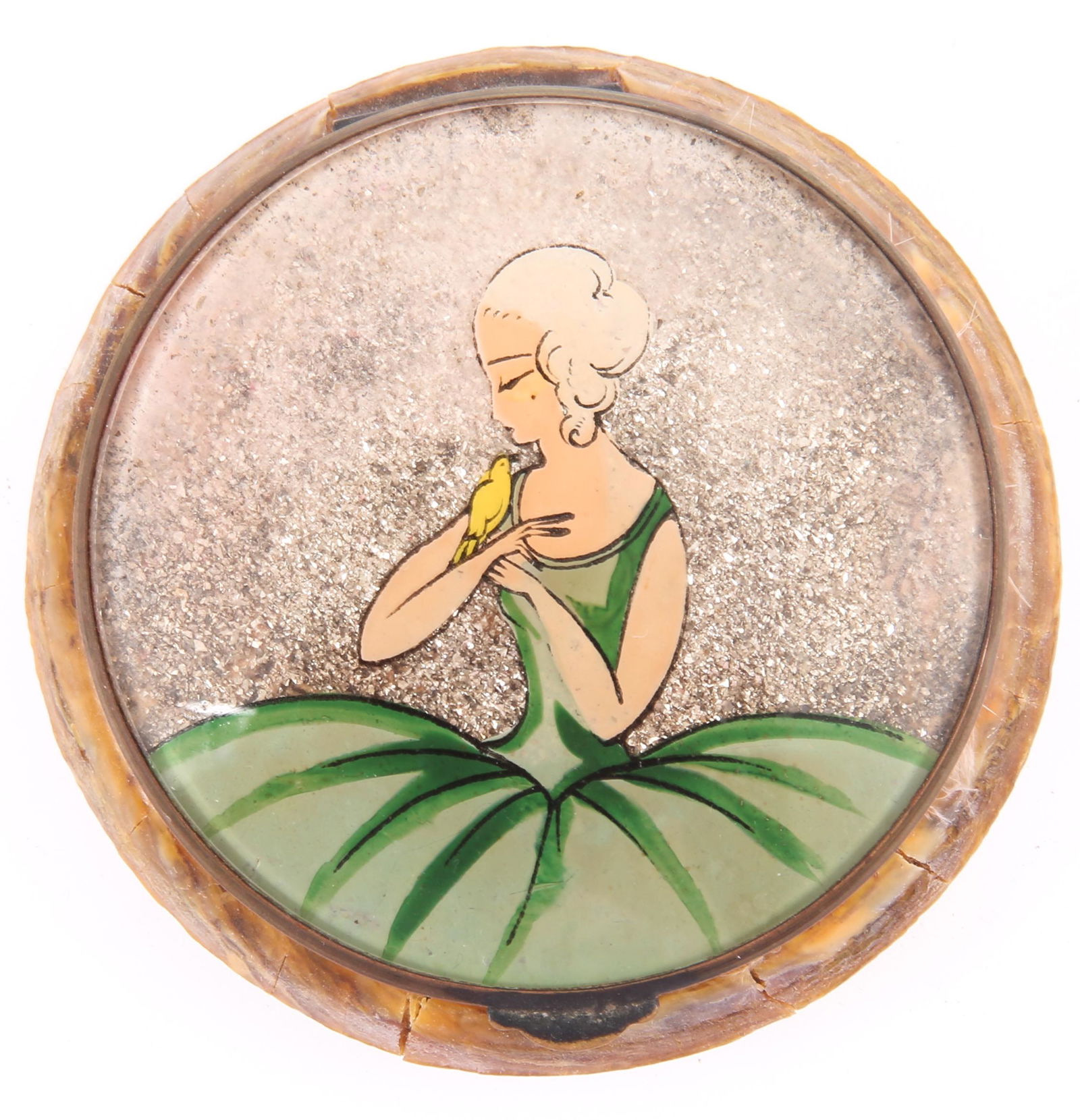 1920s FRENCH CELLULOID GLITTER COMPACT: 1920s FRENCH CELLULOID GLITTER COMPACT French celluloid compact, decorated with hand-painted image of a women with canary bird against a glitter ground. Includes powder compartment, mirror lid, and pi