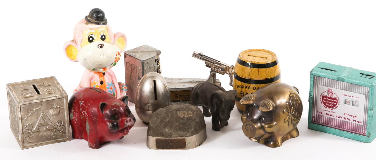 COIN BANKS - LOT OF 10: COIN BANKS - LOT OF 10 Lot of ten coin banks, including: Pink monkey, 6.75" height. Cast iron elephant, 4 x 3". Union National Bank of Manhattan, KS egg, 3.25" height. ABCD block, 3 x 3 x 3". Modern