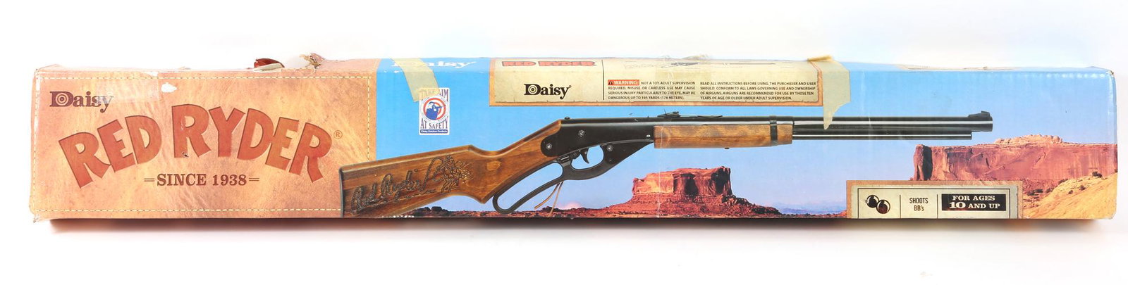 DAISY RED RYDER BB GUN MODEL 1938B: DAISY RED RYDER BB GUN MODEL 1938B Daisy Red Ryder BB gun model 1938B with box. Lever cocking, spring air. .177 BB Stock: stained solid wood Length: 35.5". Includes BBs. <