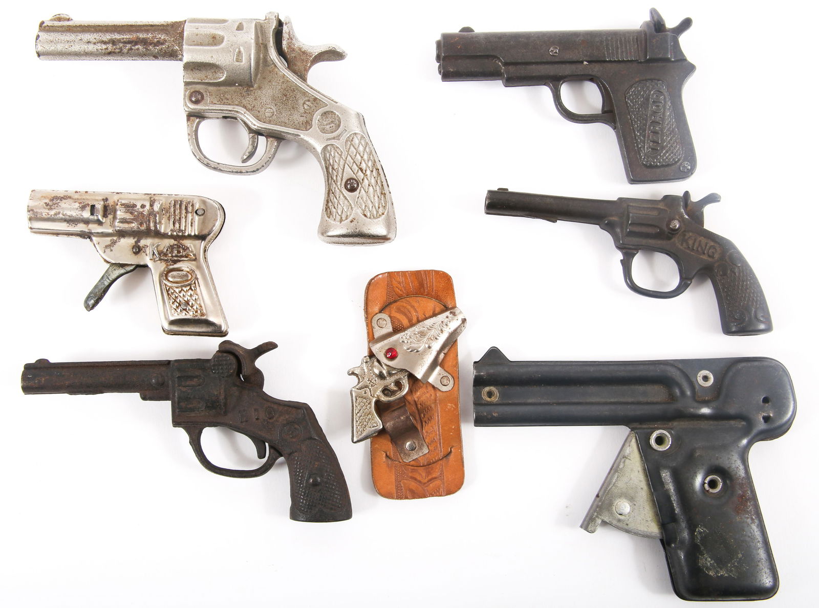 TOY CAP GUNS - LOT OF 7: TOY CAP GUNS - LOT OF 7 Lot of seven toy cap guns, including: Straits Corp Pea-Matic, length: 5.25". S&W Hio, length: 5.25". S&W unnamed, length 5.5". Dent<