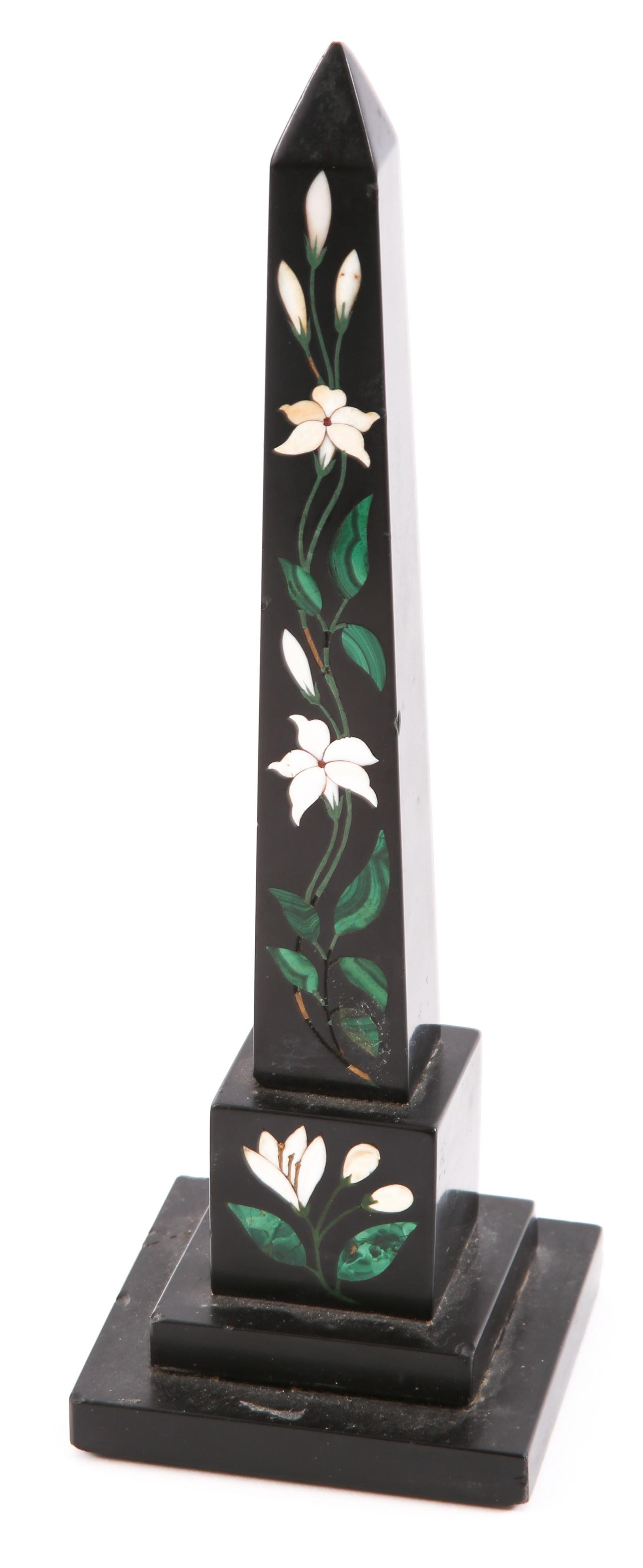 FLORAL PIETRA DURA BLACK OBELISK: FLORAL PIETRA DURA BLACK OBELISK Floral pietra dura black obelisk with white flower and green leaf inlay. Height: 9.25".
