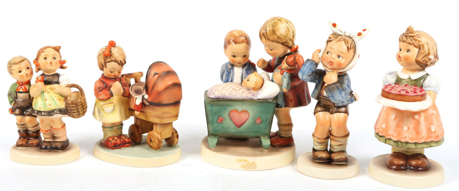 GOEBEL HUMMEL PORCELAIN FIGURINES: GOEBEL HUMMEL PORCELAIN FIGURINES Goebel Hummel procelain figurines. Inlcudes: "Blessed Event". 5.25". "Birthday Candle". 5.50". "To Market". 4". Girl with baby doll. 4". Boy with