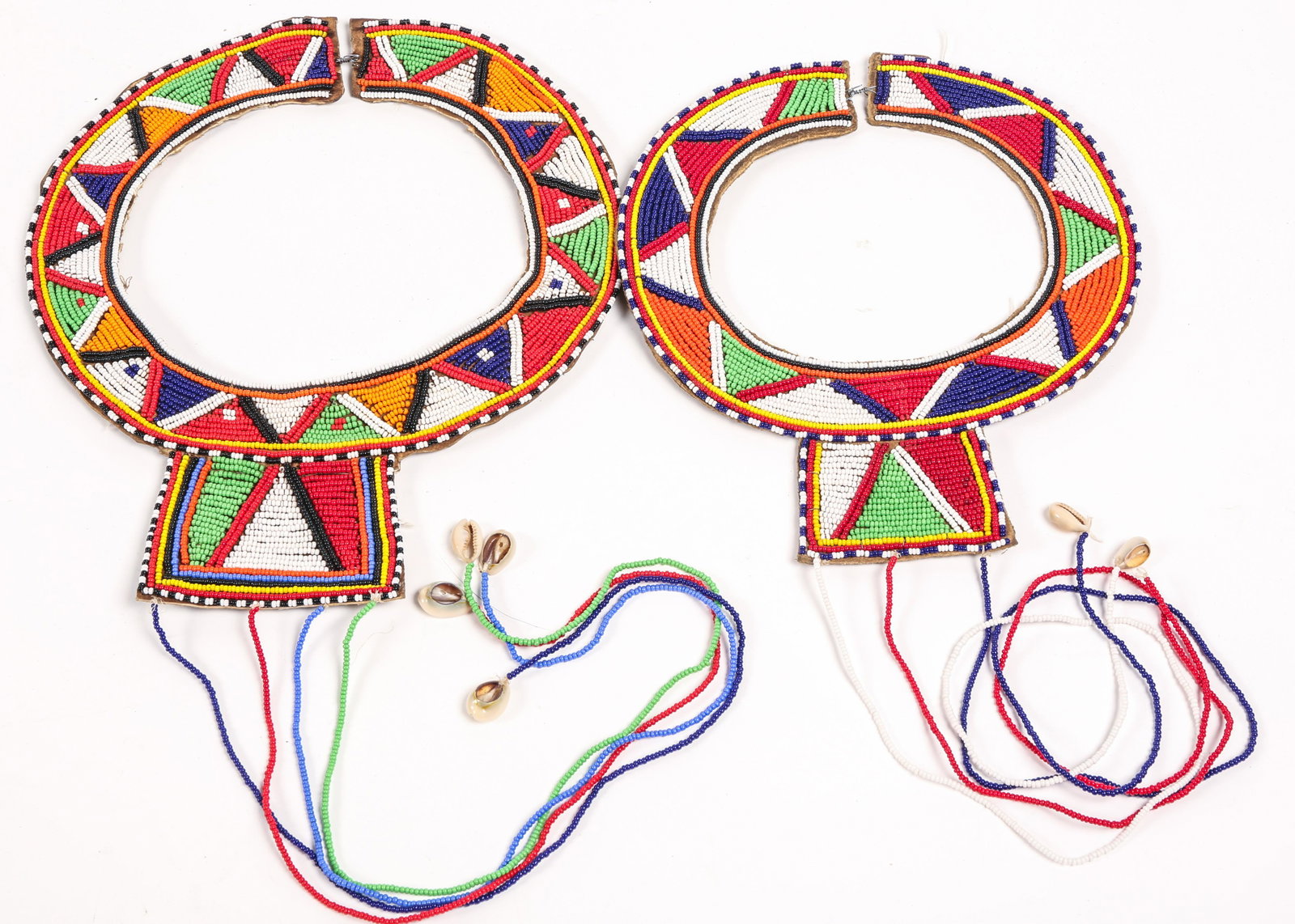 MAASAI BEADED WEDDING COLLARS LOT OF 2: MAASAI BEADED WEDDING COLLARS LOT OF 2 Lot of 2 Maasai beaded wedding collars. 20th century, most likely made for export. Beadword is affixed to leather backing with a combination of string and wire. 
