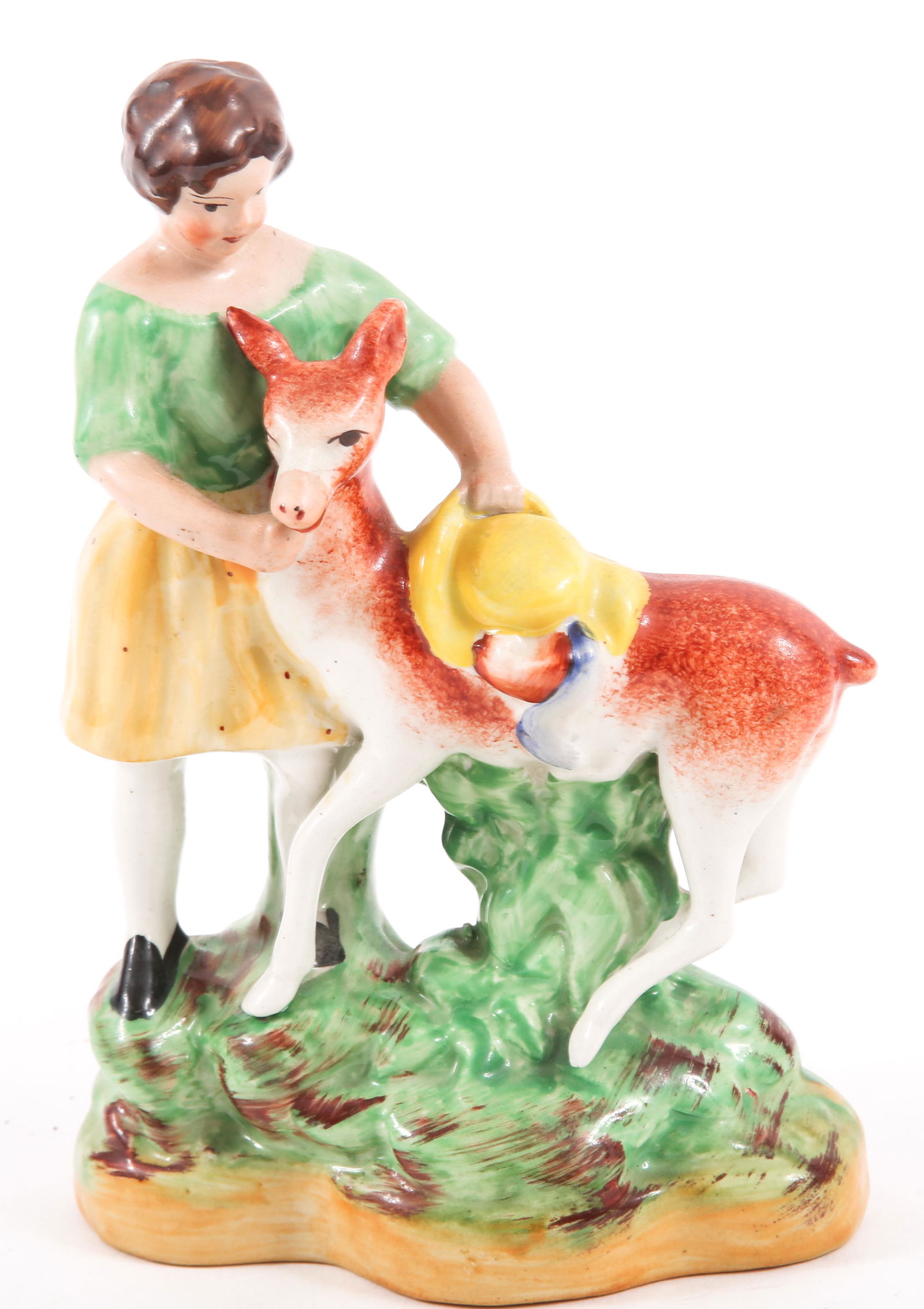 20TH CENTURY WILLIAM KENT STAFFORDSHIRE FIGURINE: 20TH CENTURY WILLIAM KENT STAFFORDSHIRE FIGURINE 20th Century Staffordshire-ware figurine by William Kent. Measures 7" tall and 4.50" wide. Marked "Staffordshire" "WK" and "England". 