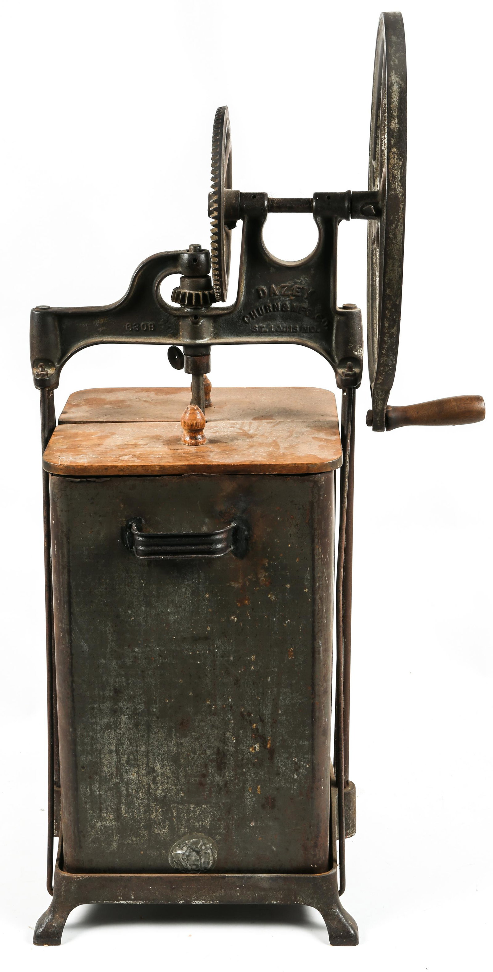 DAZEY CO. METAL BUTTER CHURN - 4 GALLON SIZE: DAZEY CO. METAL BUTTER CHURN - 4 GALLON SIZE Dazey Churn & MFG Co. 4 gallon butter churn. Metal churn and gears with wooden lid and paddle. Measures 31.25" tall, and 10" by 10" square. 