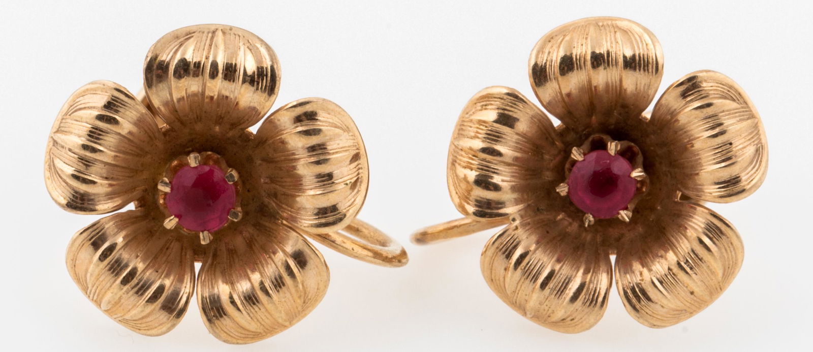 10K YELLOW GOLD FLOWER EARRINGS: 10K YELLOW GOLD FLOWER EARRINGS 10K yellow gold flower earrings accented with pink simulated stone. Screw back posts. Marked "BDA 10K" on posts. Gender: Woman's Metal: 10K Gold Weight: 2.1 grams tota
