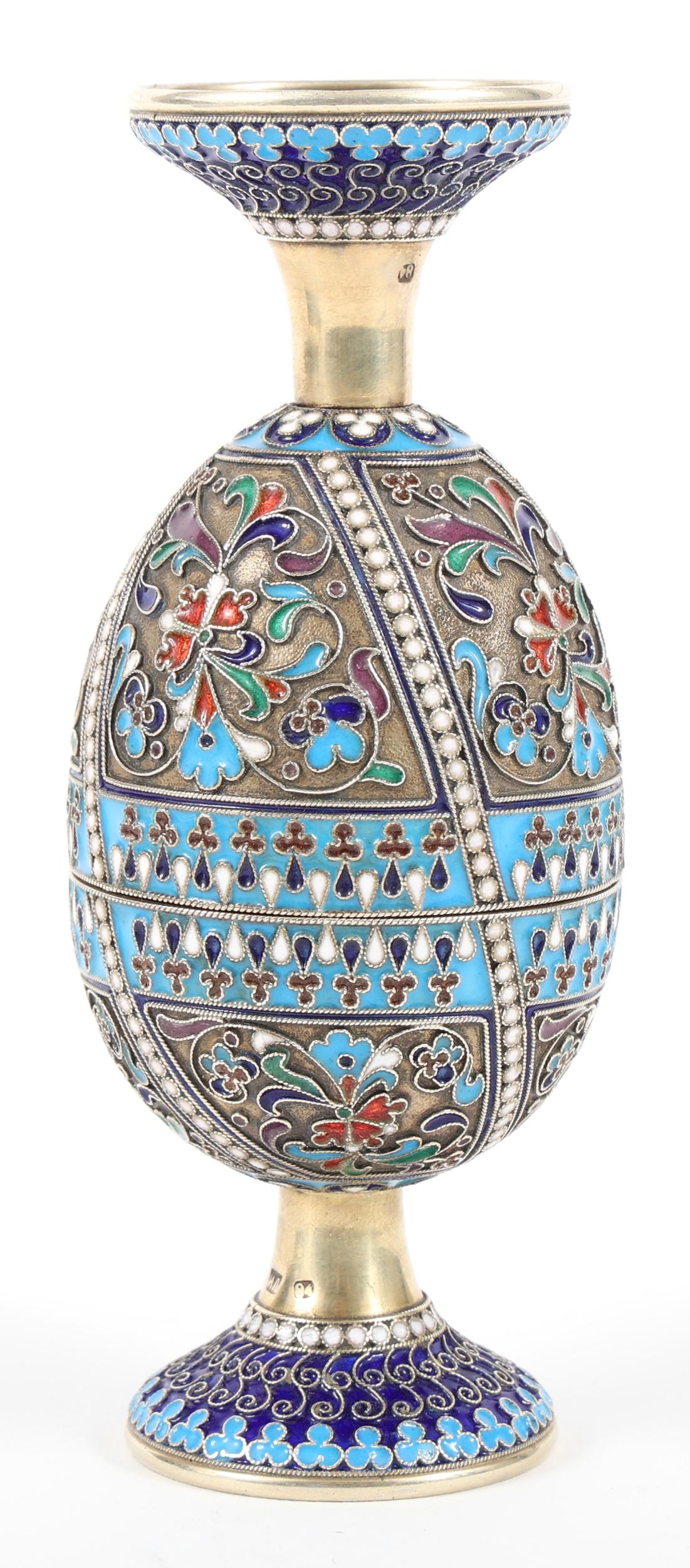 19TH C. RUSSIAN .875 SILVER ENAMEL PAINTED EGG CUPS: 19TH C. RUSSIAN .875 SILVER ENAMEL PAINTED EGG CUPS 19th century Russian .875 silver egg, painted with enamel decoration throughout the exterior. Featuring design that fits cups together in the s